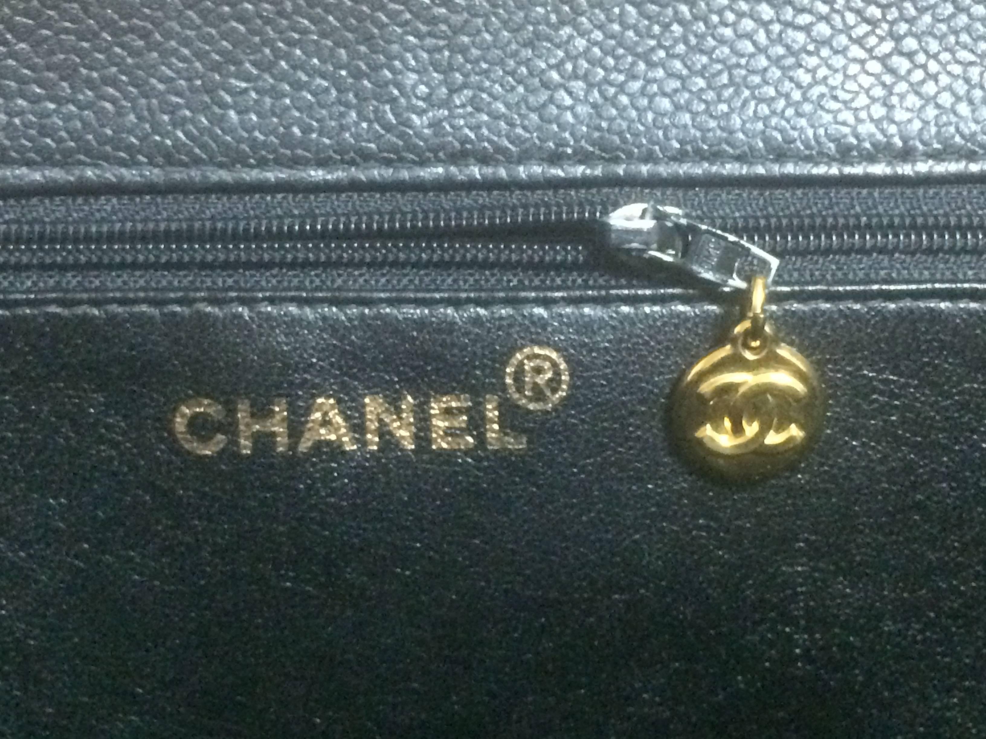 Women's Vintage CHANEL black caviar extra large tote bag with gold tone chain straps. For Sale