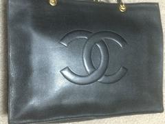 Vintage CHANEL black caviar extra large tote bag with gold tone chain straps.