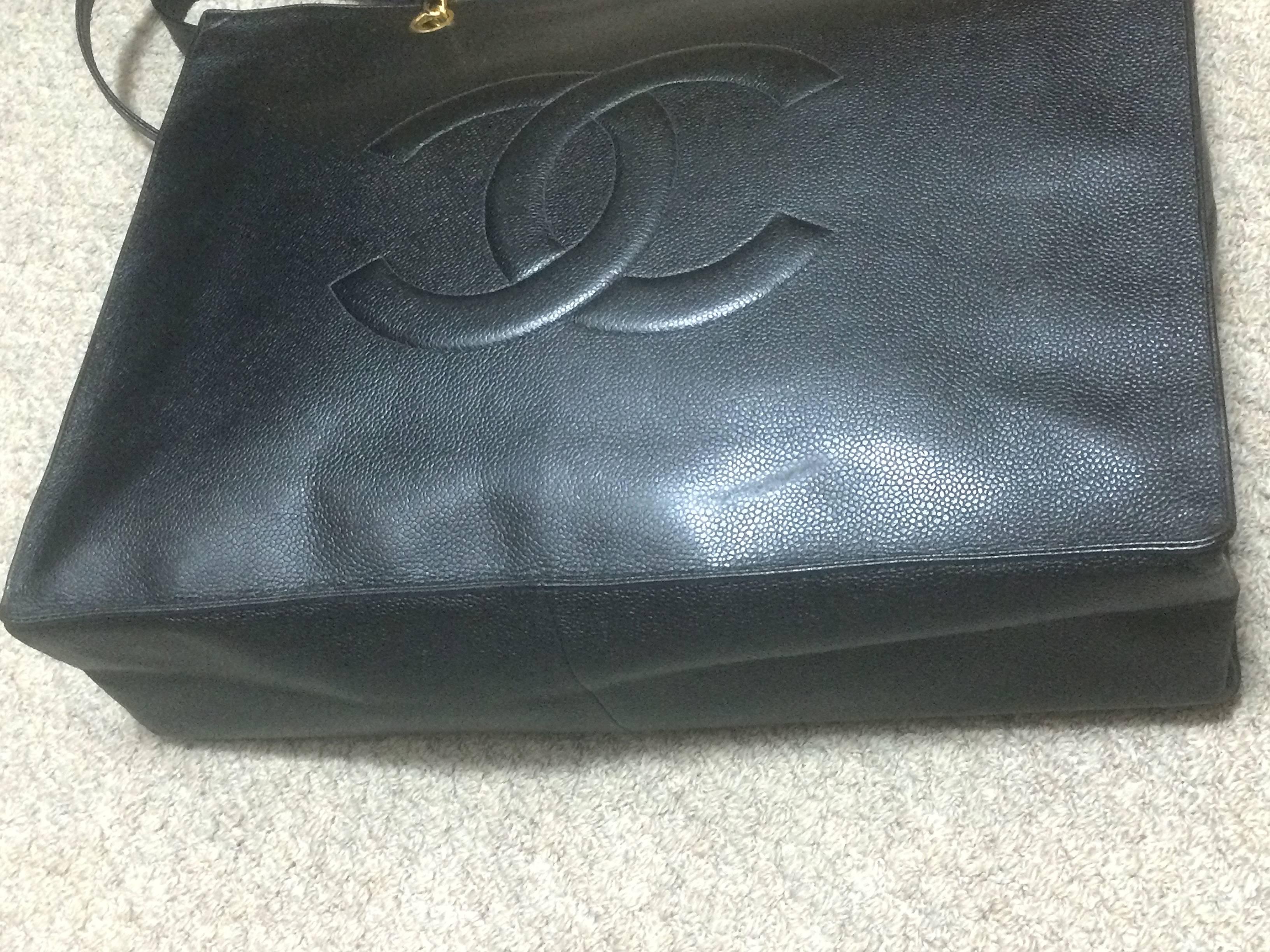 Gray Vintage CHANEL black caviar extra large tote bag with gold tone chain straps. For Sale