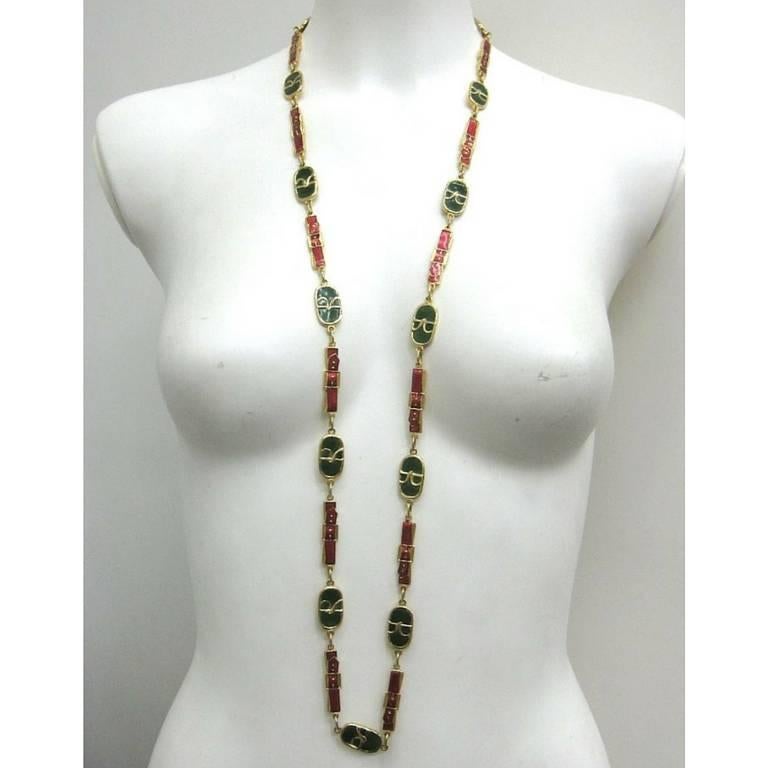 1970's, 1980's Vintage Roberta di Camerino rare orange and green colorful and golden chain jewelry logo charm long necklace and belt.

Introducing a rare and fab jewelry necklace and belt from Roberta di Camerino back in the 70's - 80's.
It is a