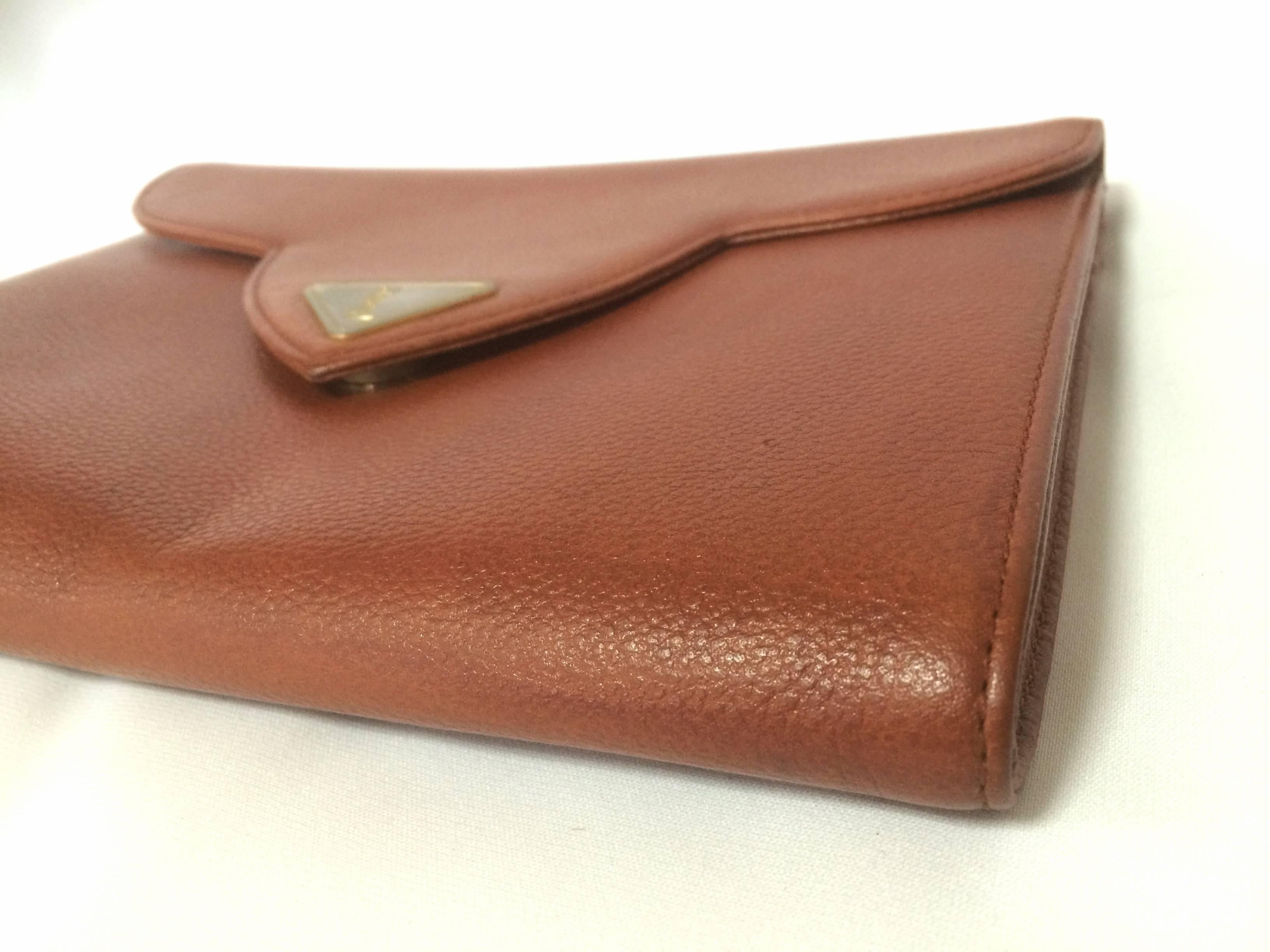 Brown Vintage Yves Saint Laurent genuine brown leather clutch purse with beak tip flap