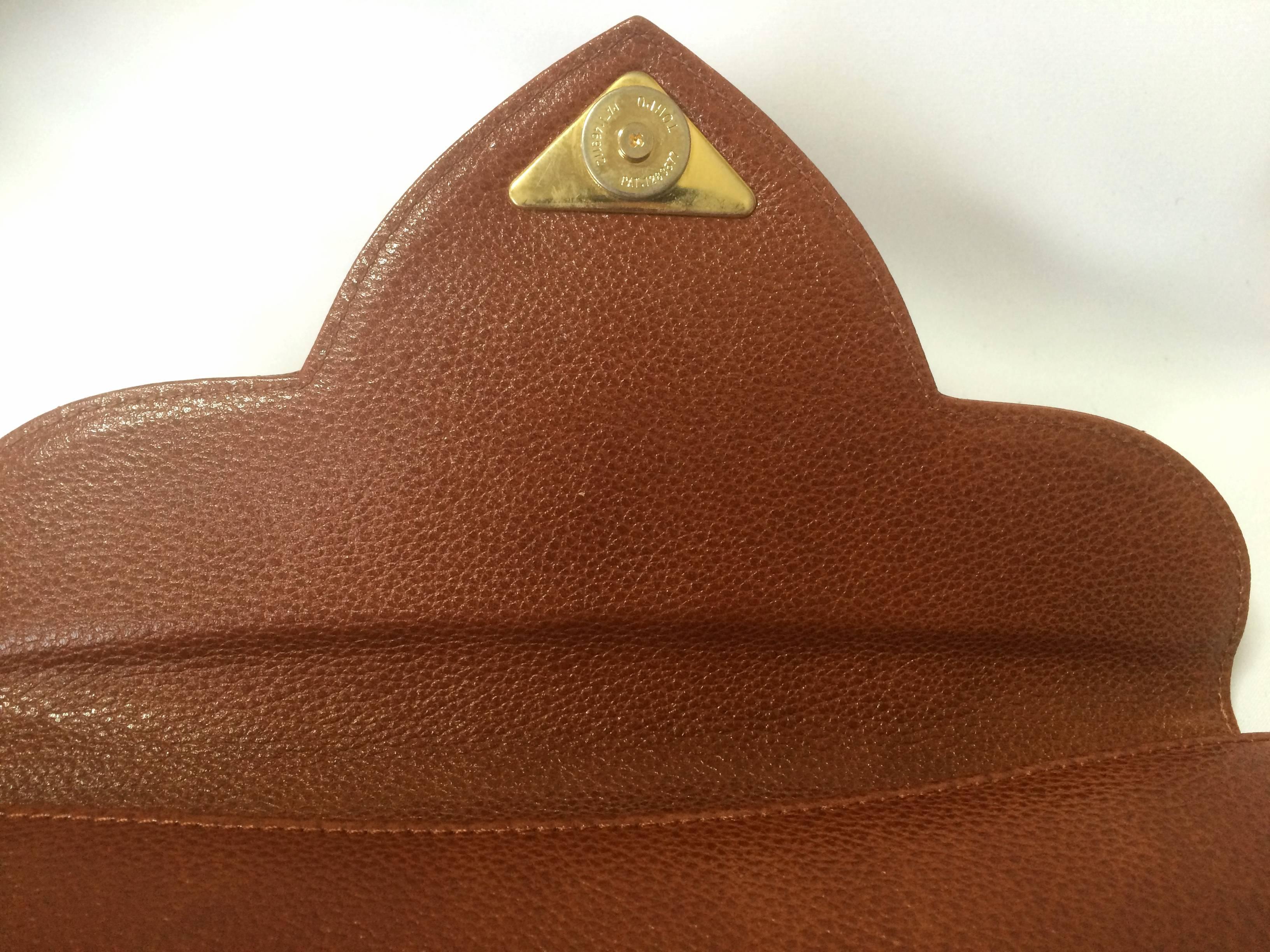 Women's Vintage Yves Saint Laurent genuine brown leather clutch purse with beak tip flap