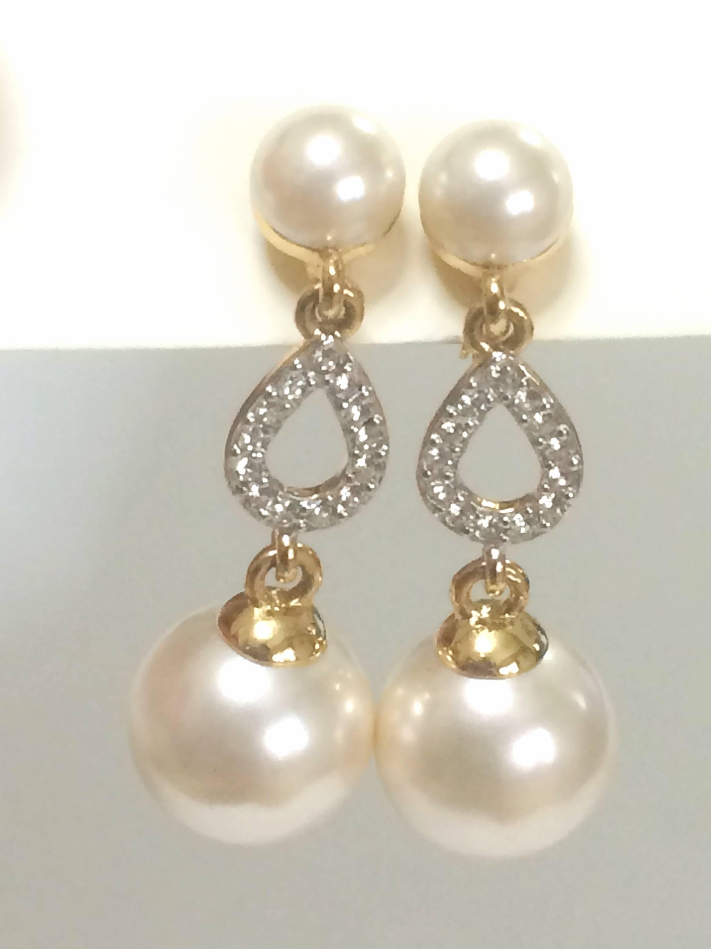 1990s. Vintage Nina Ricci white faux pearl and crystal stone teardrop dangling earrings. Classic and beautiful jewelry piece.

Introducing a pair of classic dangling earrings from Nina Ricci back in the 90's.

Featuring faux pearl balls with the