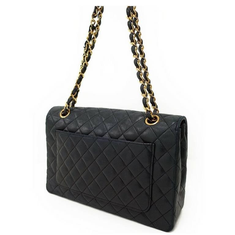 1980s. Vintage Chanel rare 2.55 classic black lambskin bag with round and golden CC closure.

Rare design on the flap but classic 2.55 purse. 
Introducing a one-of-a-kind unique design vintage CHANEL bag, featuring round stitch and golden CC