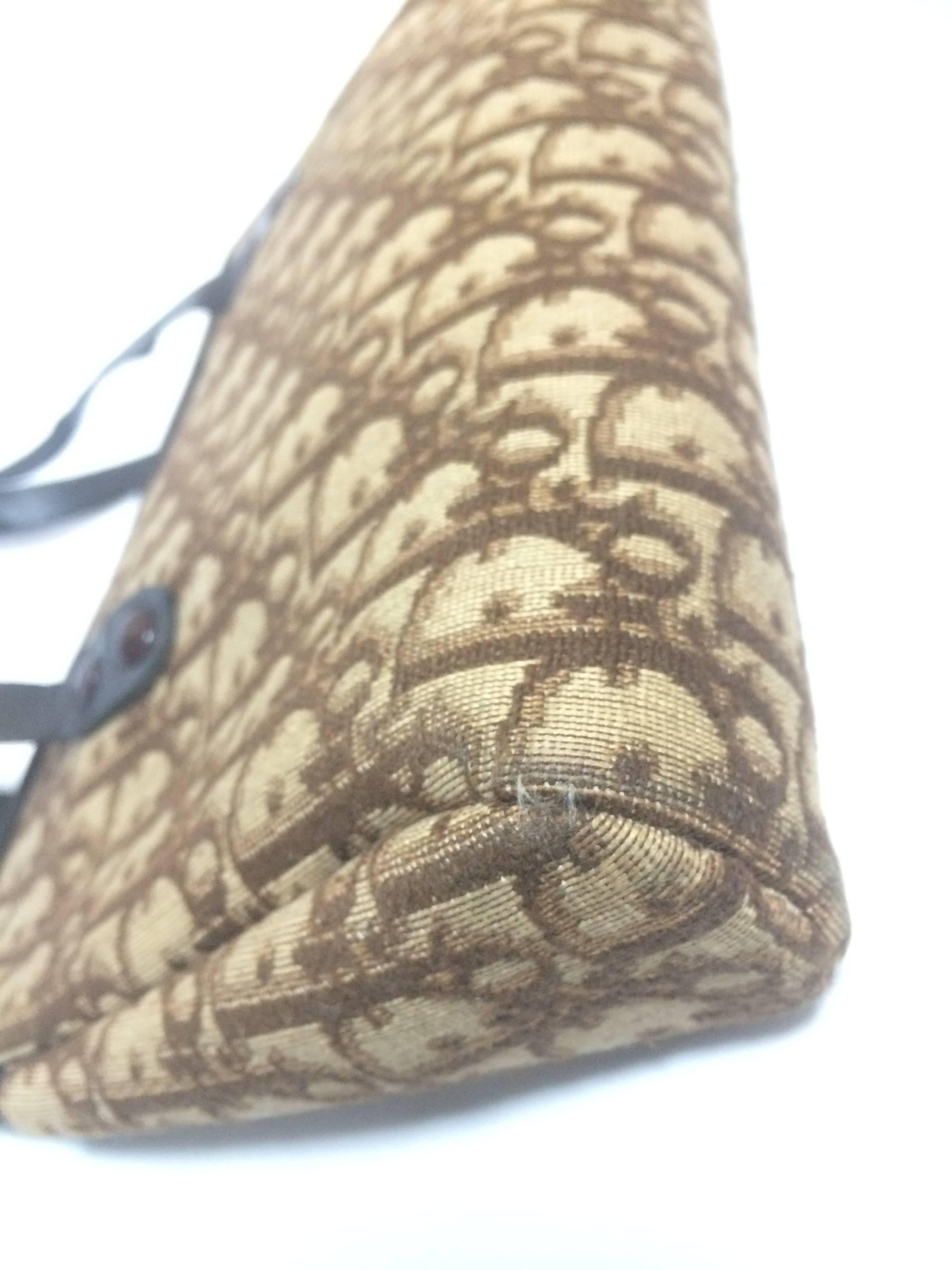 Brown Vintage Christian Dior brown trotter jacquard mini handbag with leather handles.