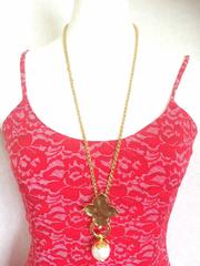 MINT. Vintage Yves Saint Laurent chain long necklace with faux pearl top.