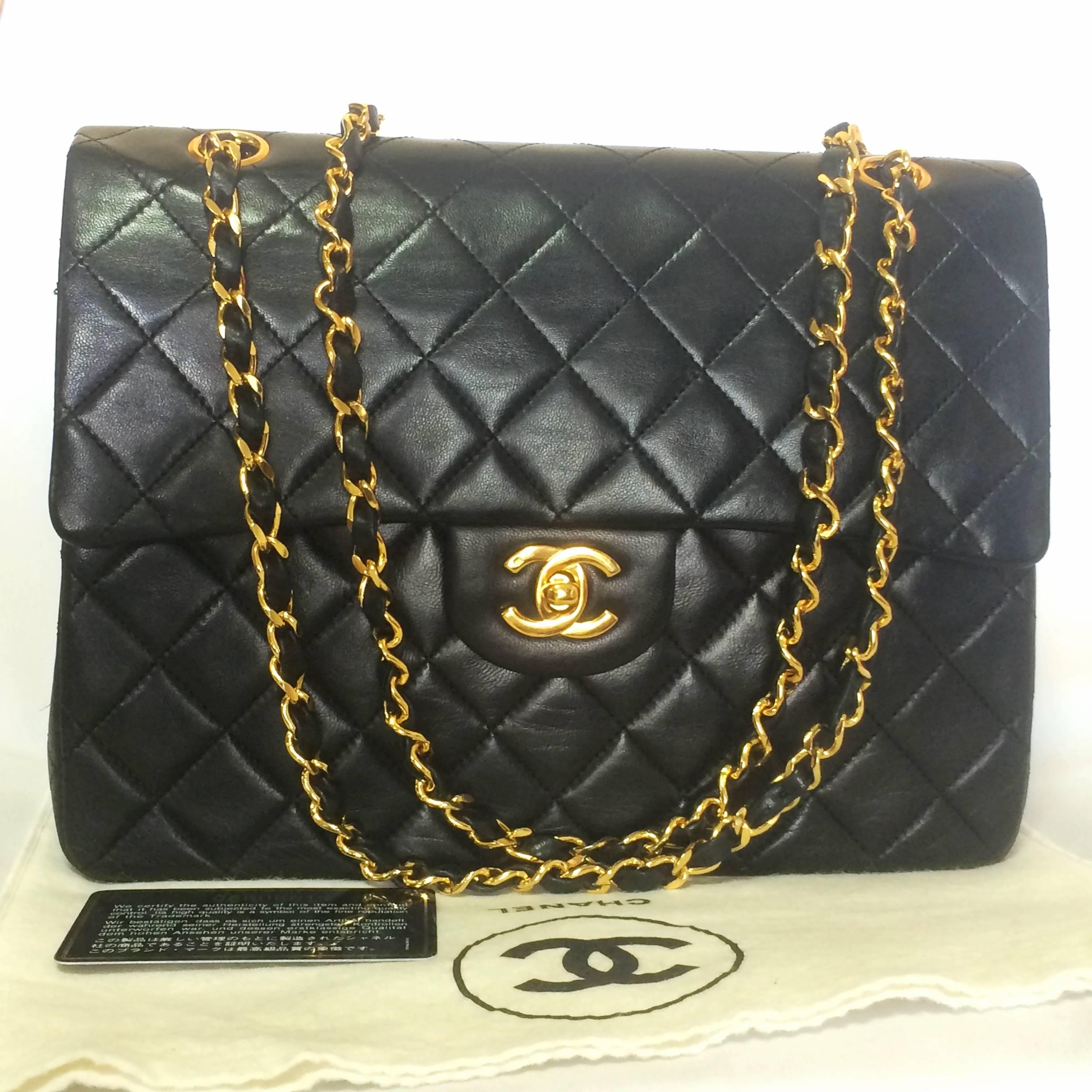 1980s. Vintage CHANEL black lambskin classic 2.55 double flap shoulder purse with gold tone chain straps. 
The very best classic CHANEL purse for the rest of your life....

Introducing another vintage piece, a classic black lamb leather 2.55