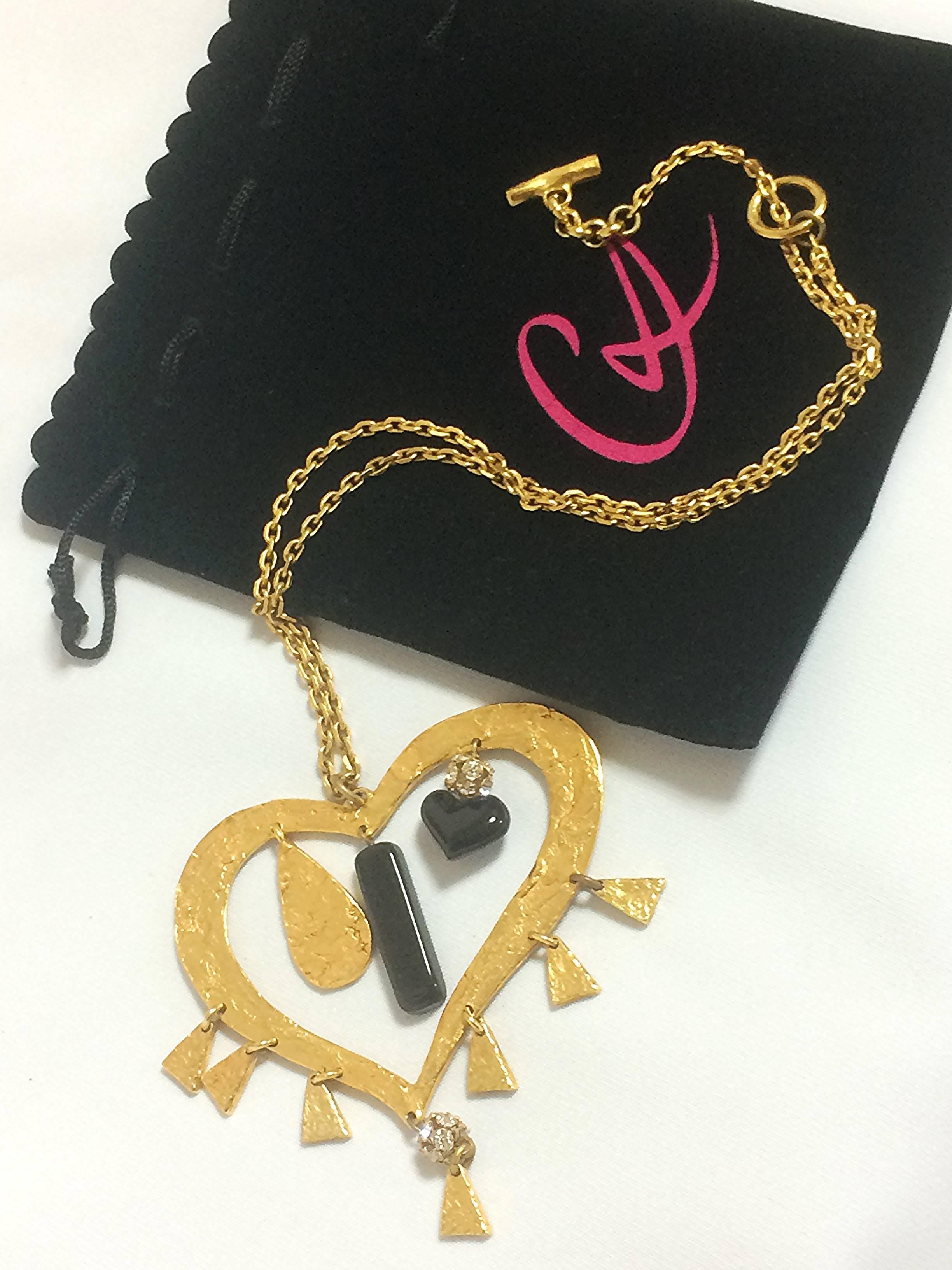 Art Deco Vintage Christian Lacroix golden large heart necklace with dangling charms. For Sale