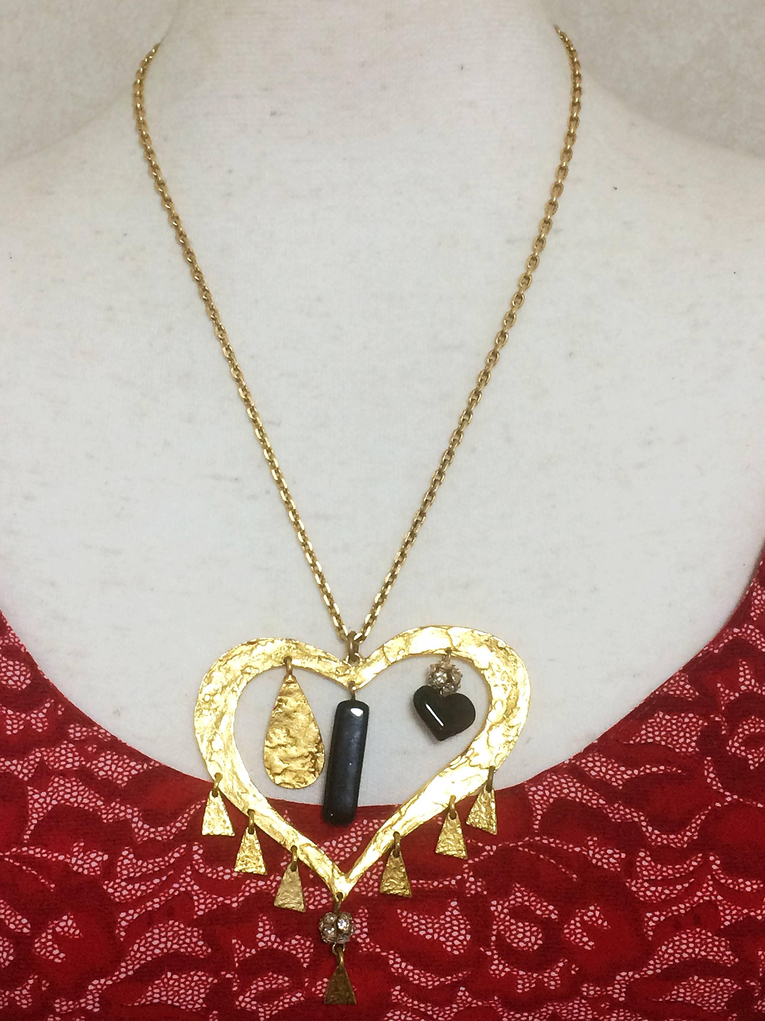 1990s. Vintage Christian Lacroix golden outlined large heart pendant top necklace with dangling charms and crystal stones. Perfect gift jewelry.

Introducing a rare vintage piece from Christian Lacroix from early 90's. 
Gorgeous chain statement