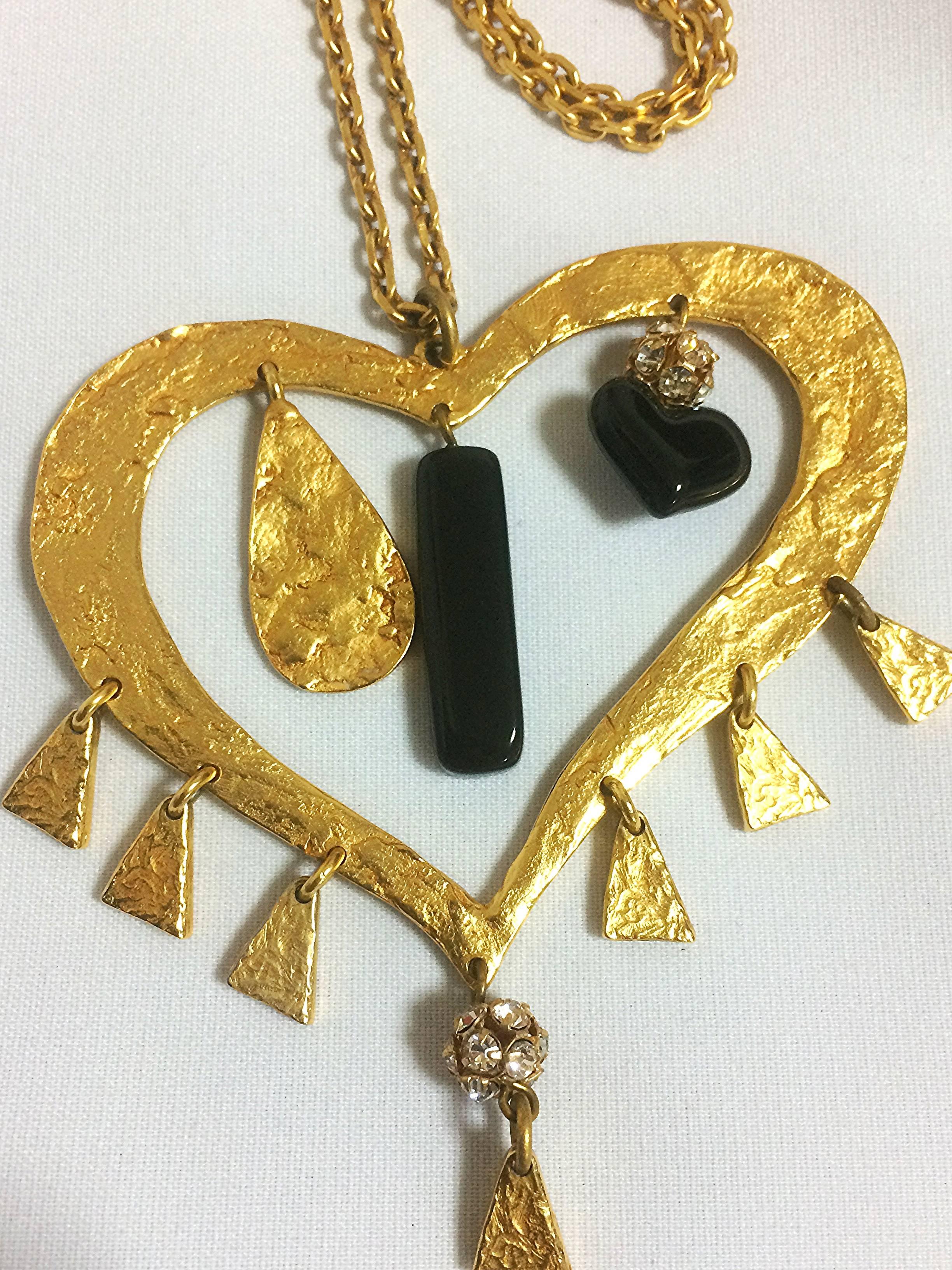 Vintage Christian Lacroix golden large heart necklace with dangling charms. For Sale 1