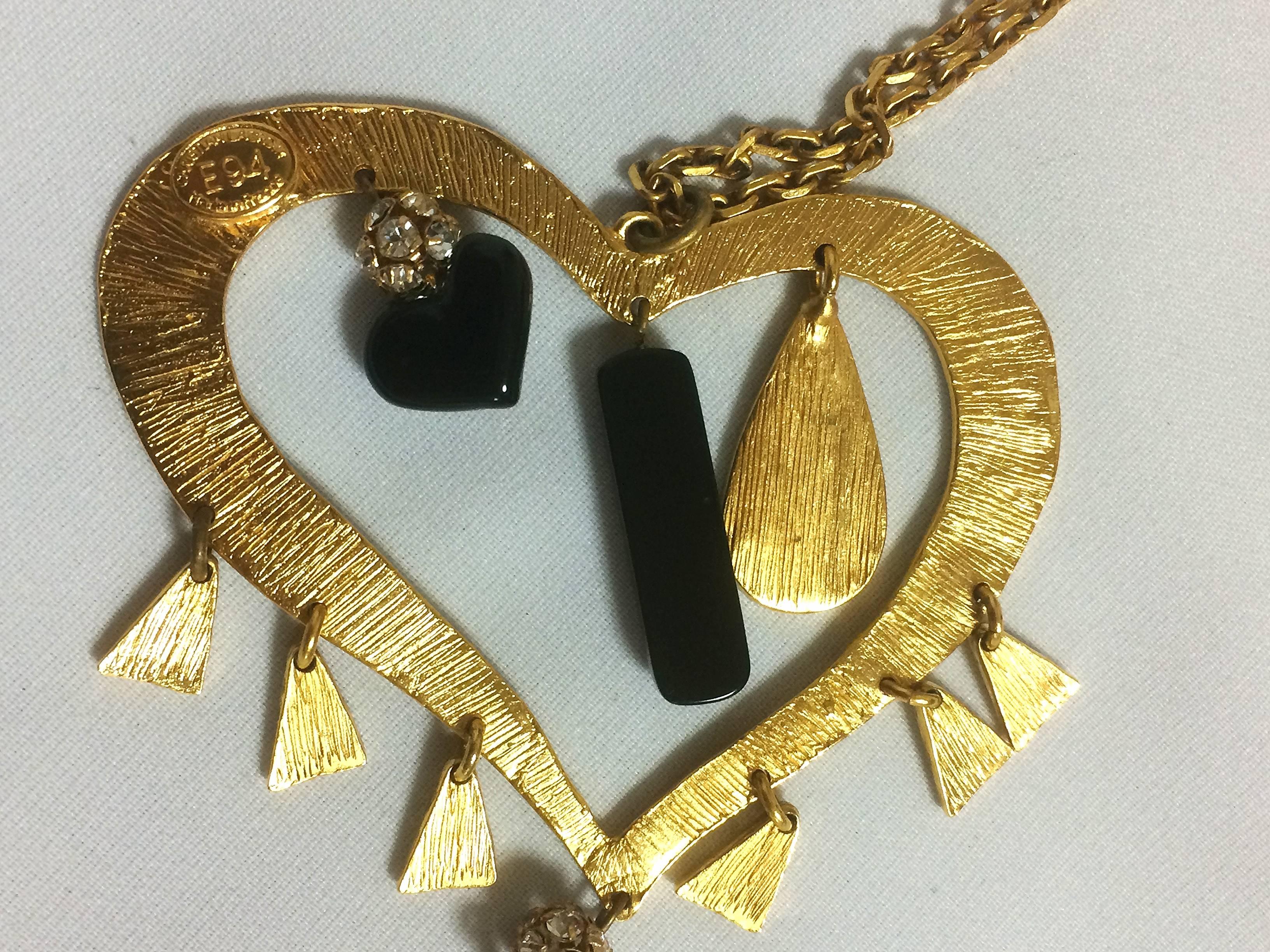 Women's Vintage Christian Lacroix golden large heart necklace with dangling charms. For Sale