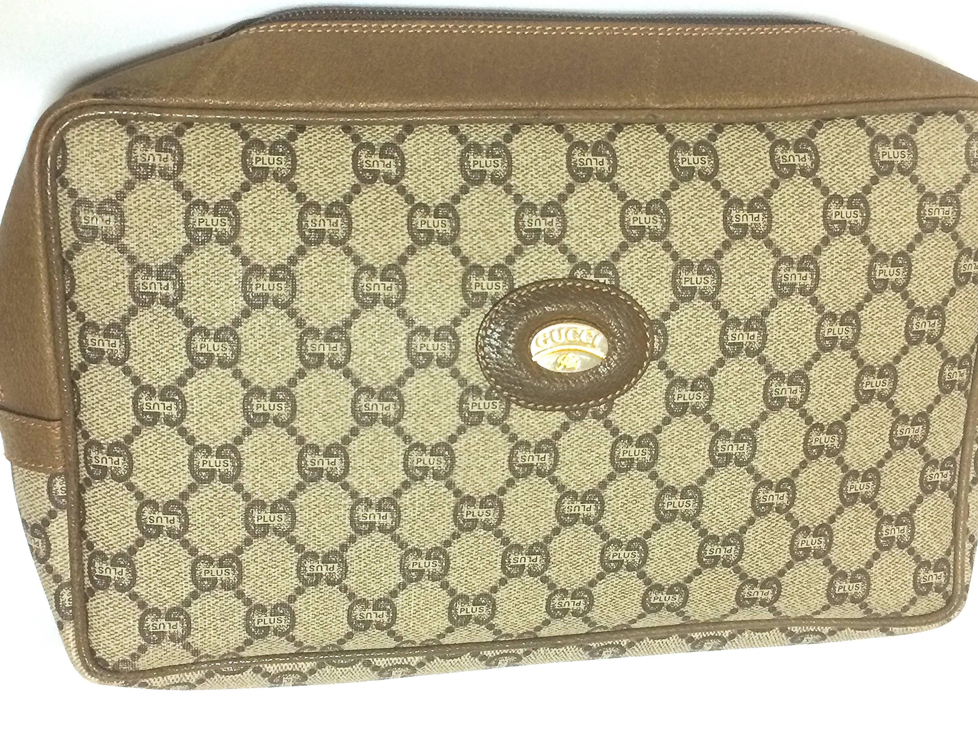 1980's vintage Gucci Plus beige monogram large size  makeup purse, toiletry pouch, purse with golden logo plate. Unisex use.

Looking classic and elegant with its iconic monogram patterns and the Gucci Plus gold tone plate at the front.
The purse