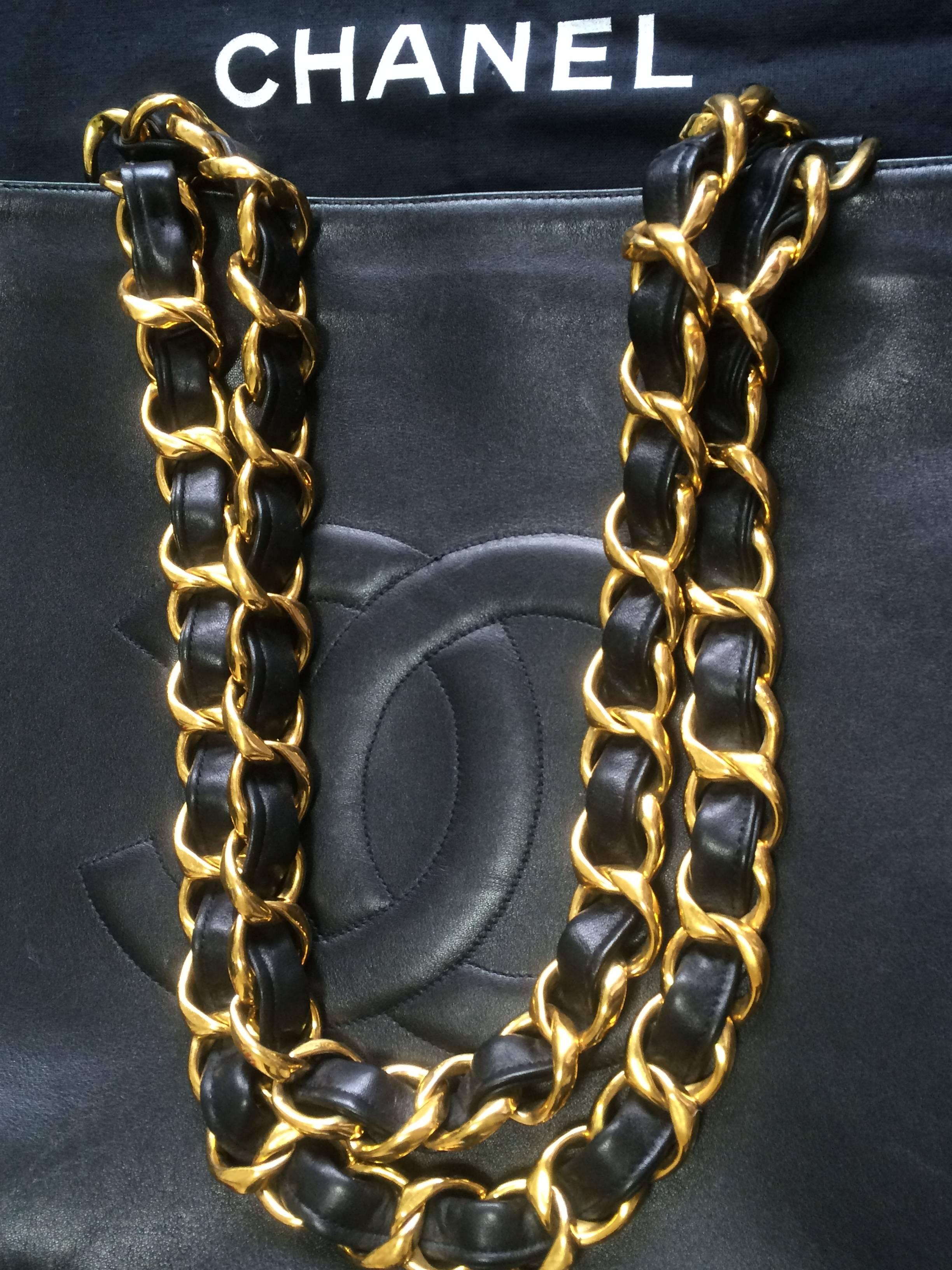 Women's Vintage CHANEL black calfskin large tote bag with gold tone chain handles and CC