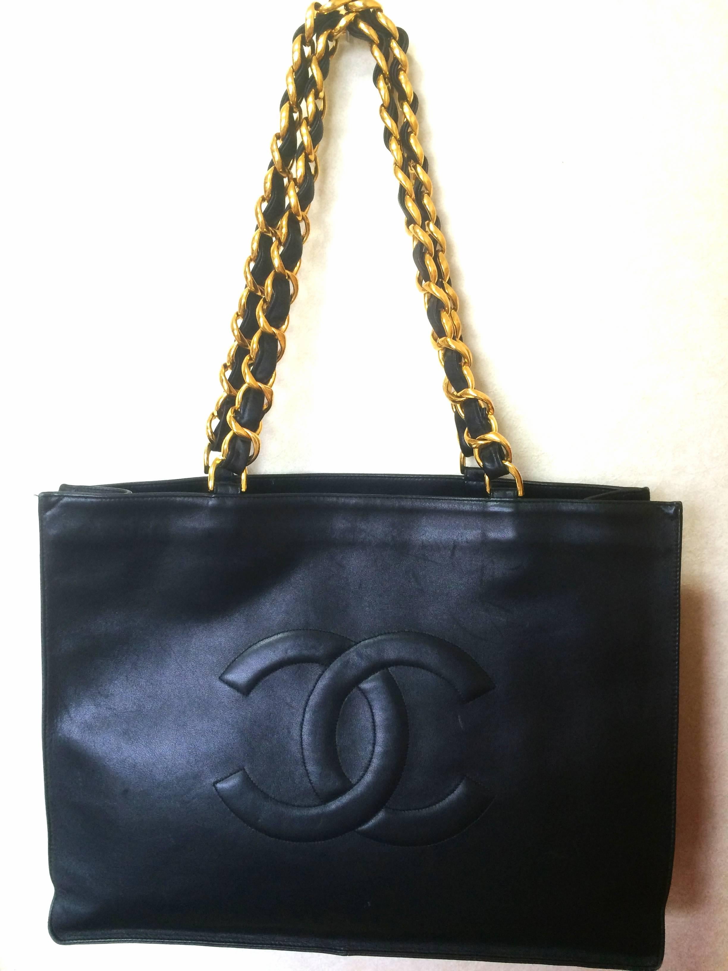 Vintage CHANEL black calfskin large tote bag with gold tone chain handles and CC 5