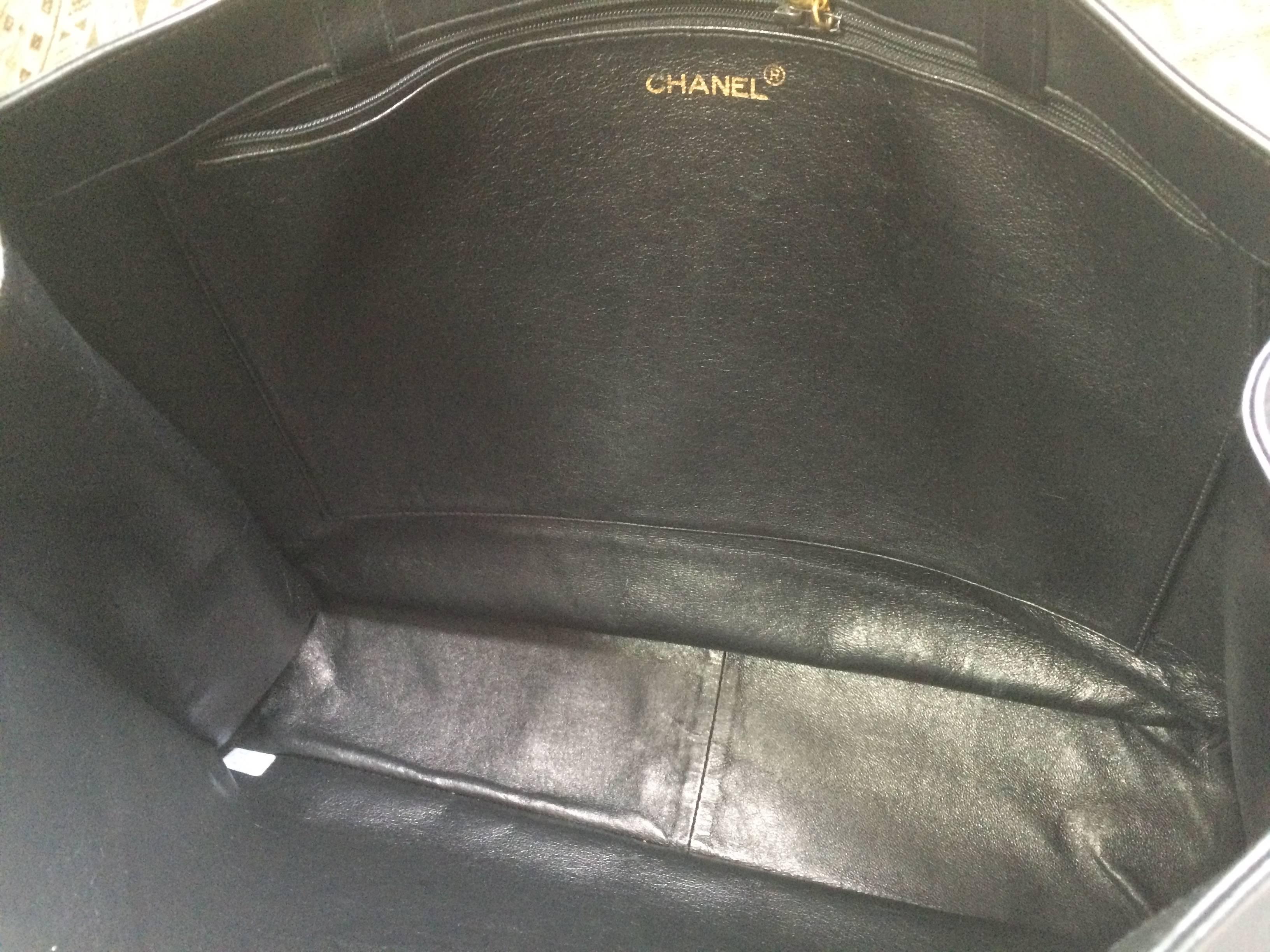 Vintage CHANEL black calfskin large tote bag with gold tone chain handles and CC 2