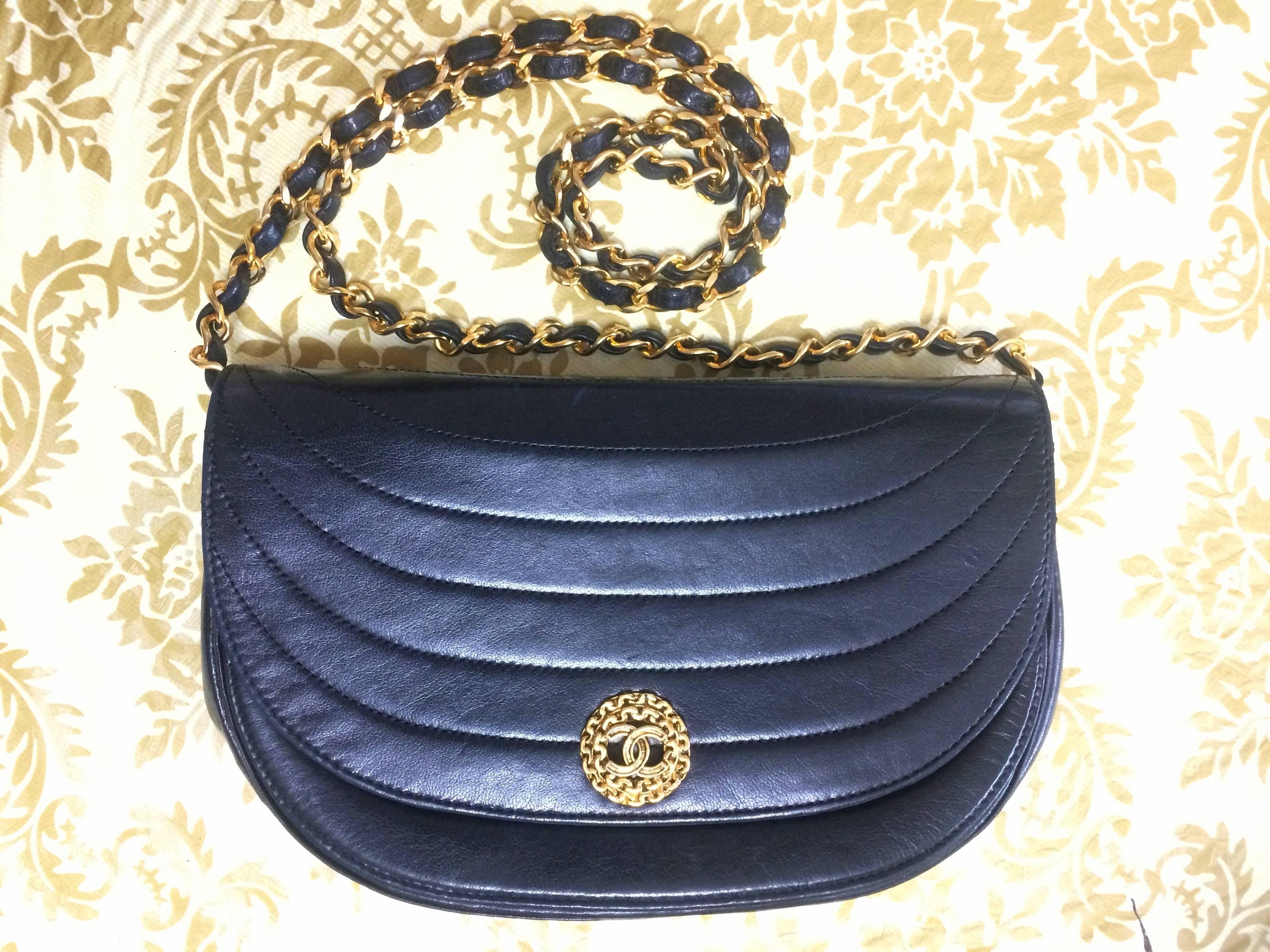 Women's Vintage Chanel black lambskin half moon 2.55 chain shoulder bag with golden CC.