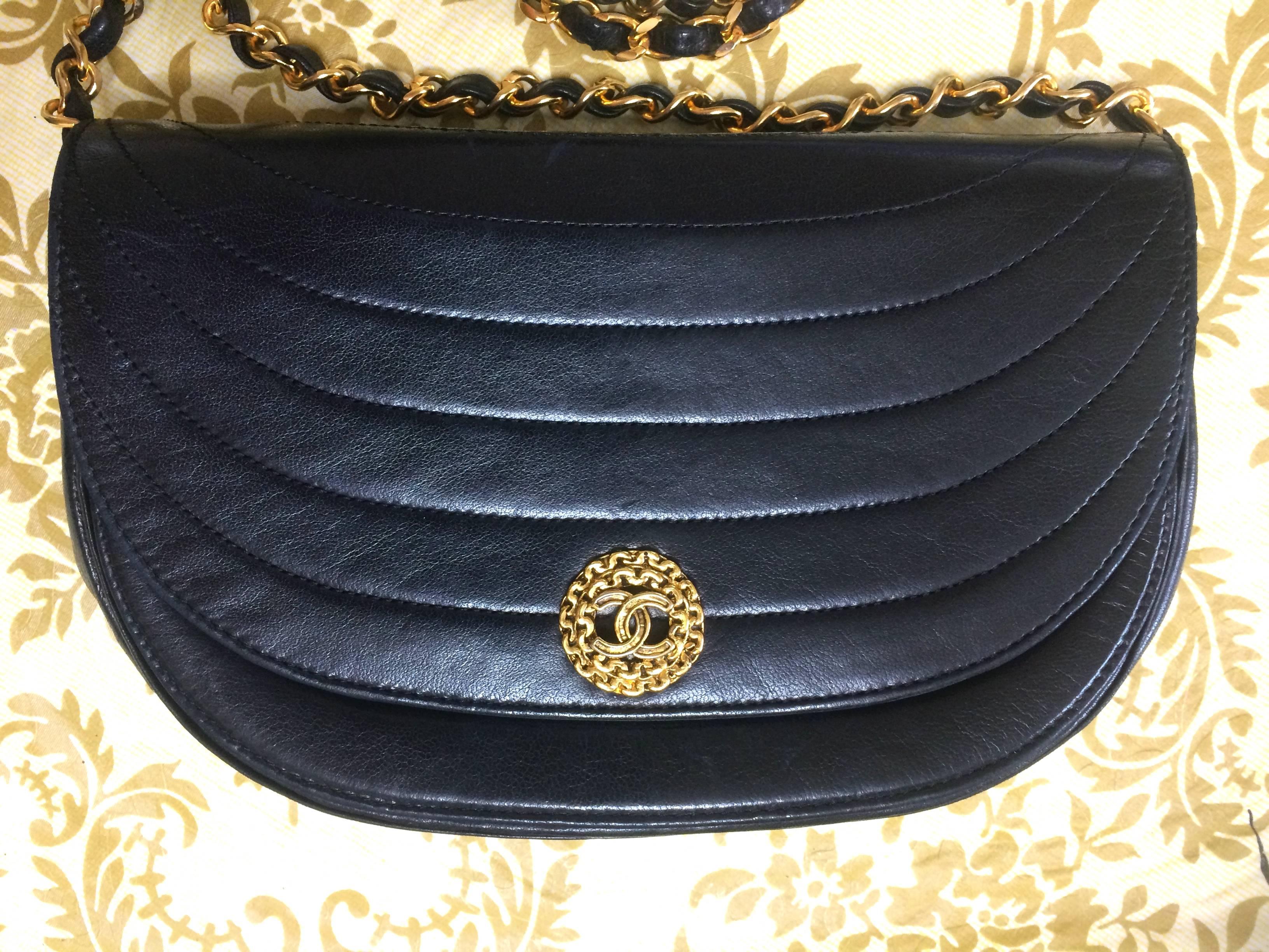 1980's Chanel black lambskin half moon shape 2.55 shoulder bag with golden round flower CC motif closure. Rare masterpiece purse.

Introducing another old masterpiece from CHANEL back in the 80's.
Classic but unique halfmoon shape mini 2.55 black