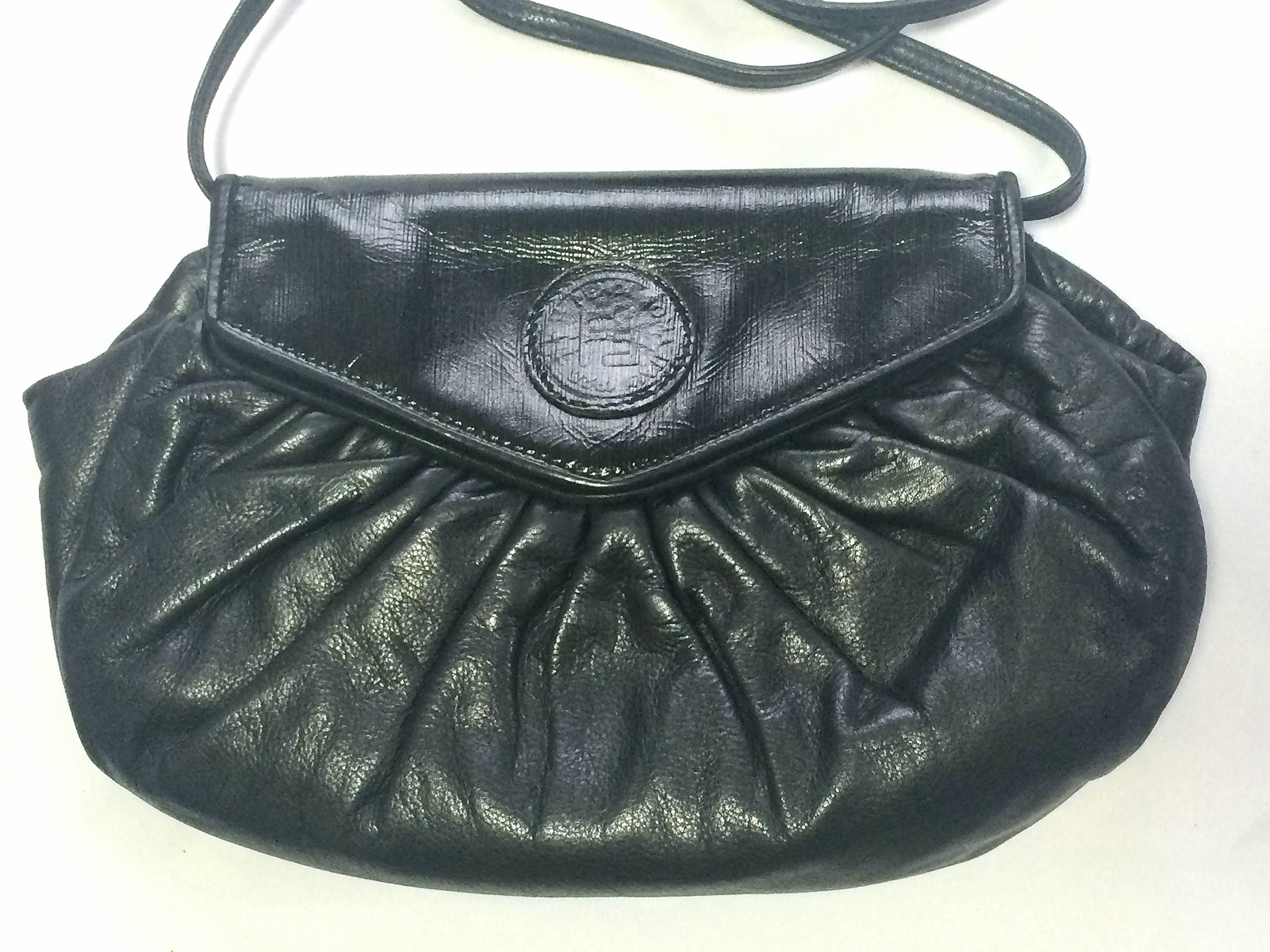 1980s. vintage FENDI black nappa leather oval round shape shoulder purse. Can be a clutch, pouch bag as well.

For all FENDI vintage lovers, this unique and rare vintage masterpiece is right for you!
Cute form in round shape in black nappa
