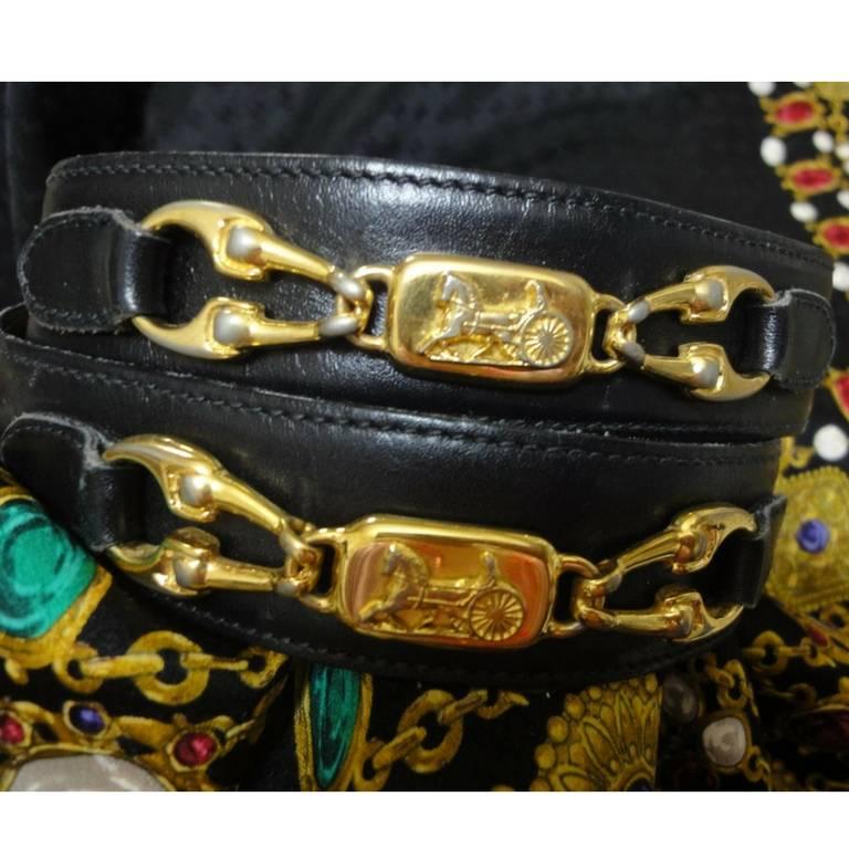 Black Vintage Celine black leather belt with golden carriage and horse motif. 65 