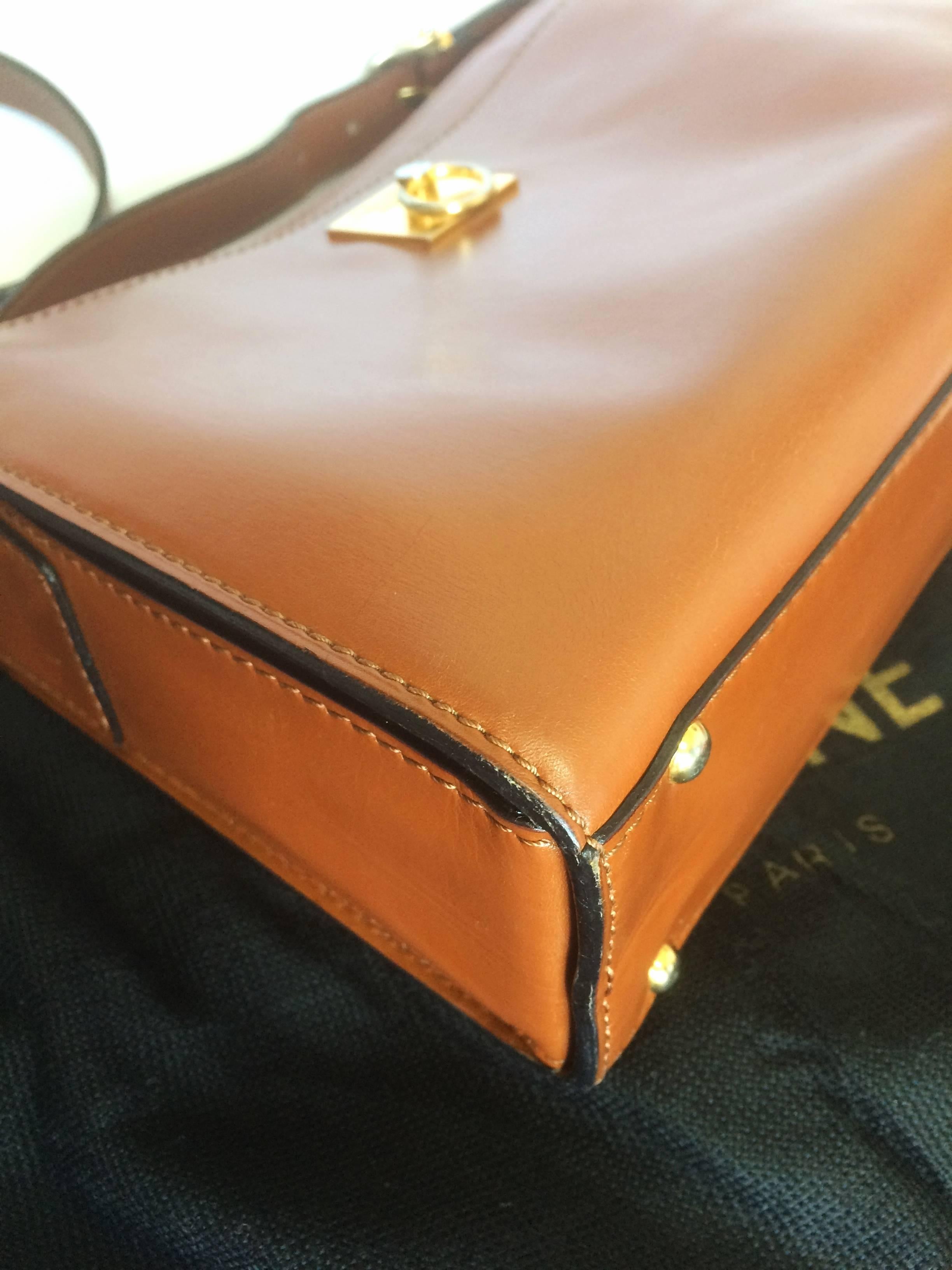 Women's Vintage CELINE genuine brown leather shoulder bag with golden logo motif.