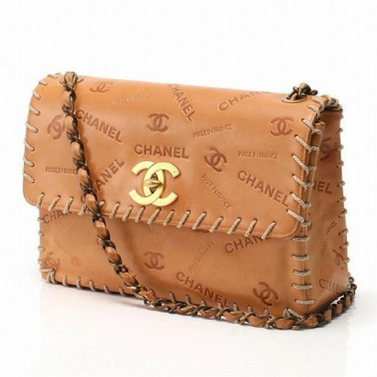 Vintage CHANEL tan brown allover logo embossed leather jumbo, large