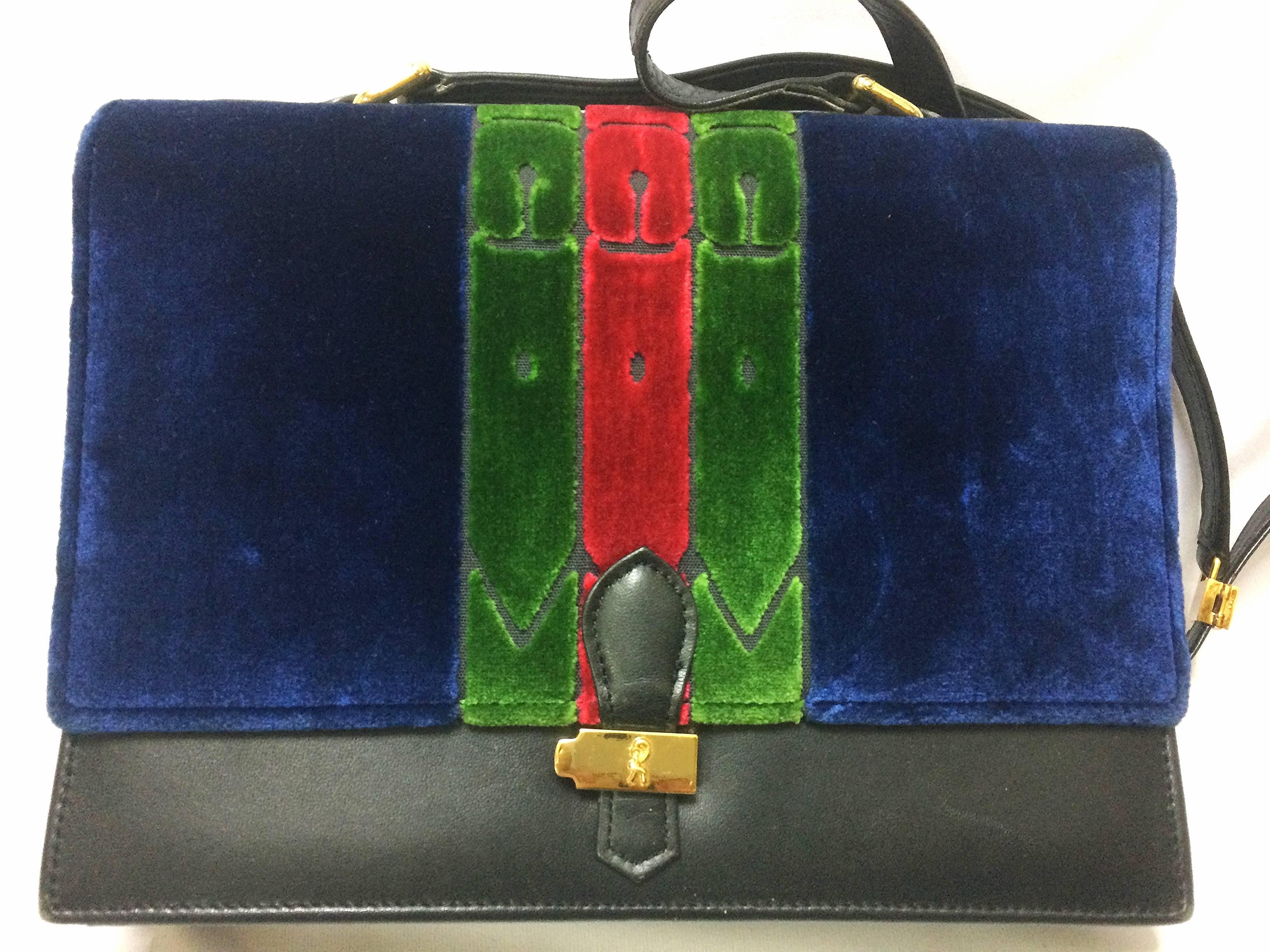 1980's Vintage Roberta di Camerino red, navy, and green ribbon velvet shoulder purse with golden R motif closure. Classic bag.

For all Roberta vintage lovers, this clutch is the one for you!

Very chic and cute! 
You will love its color iconic
