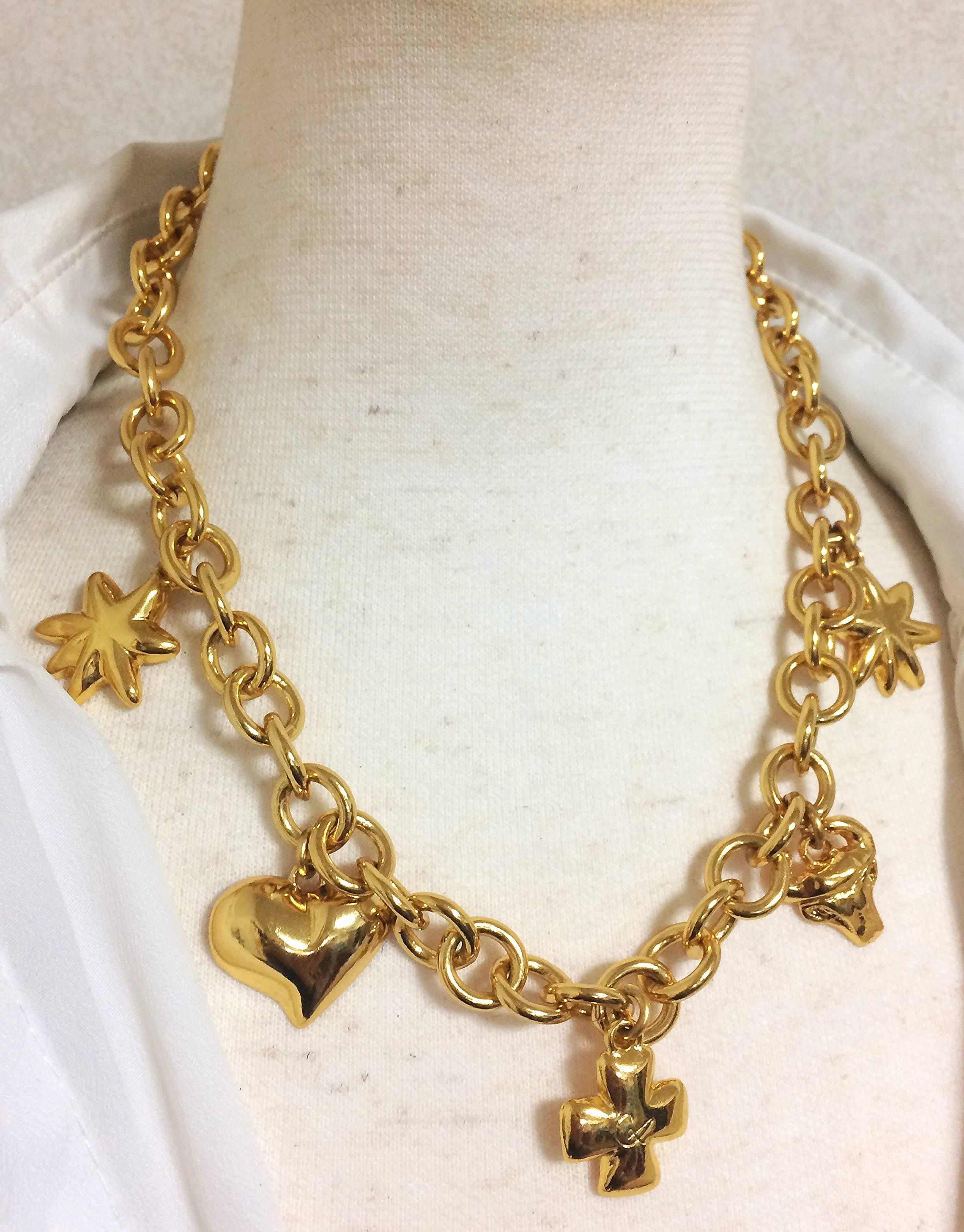 1990s. Vintage Christian Lacroix chain statement necklace with golden heart mark, star, clover, and bull charms. Rare masterpiece.

Introducing another rare and fabulous jewelry necklace from Christian Lacroix back in the 90's. Shining beautifully