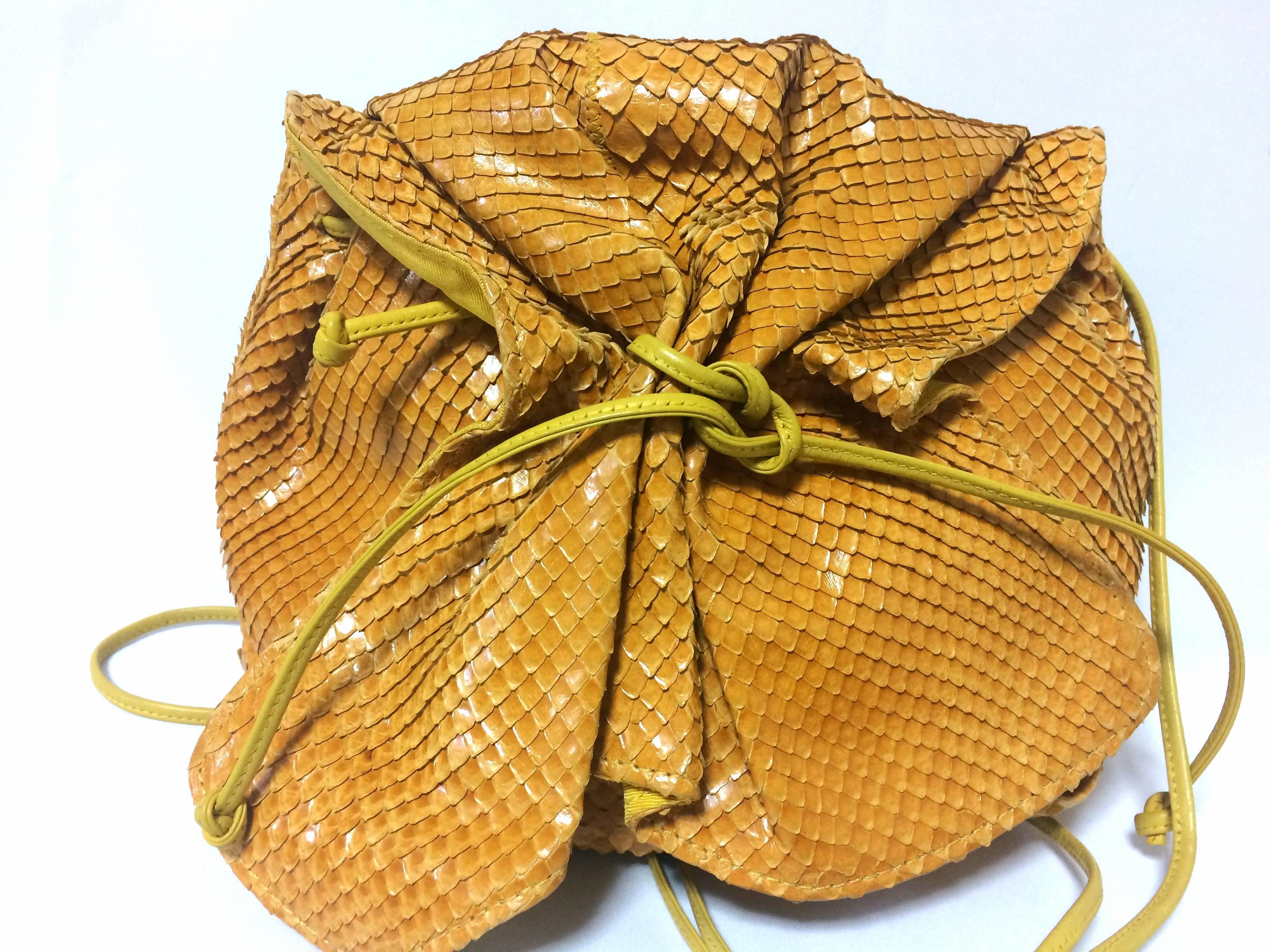 1990s. Vintage Carlos Falchi genuine yellow snakeskin shoulder bag in unique round form. Can be pouch too.

Introducing a cute and adorable design and shape pouch shoulder bag from Carlos Falchi back in the 90's. Made out of genuine