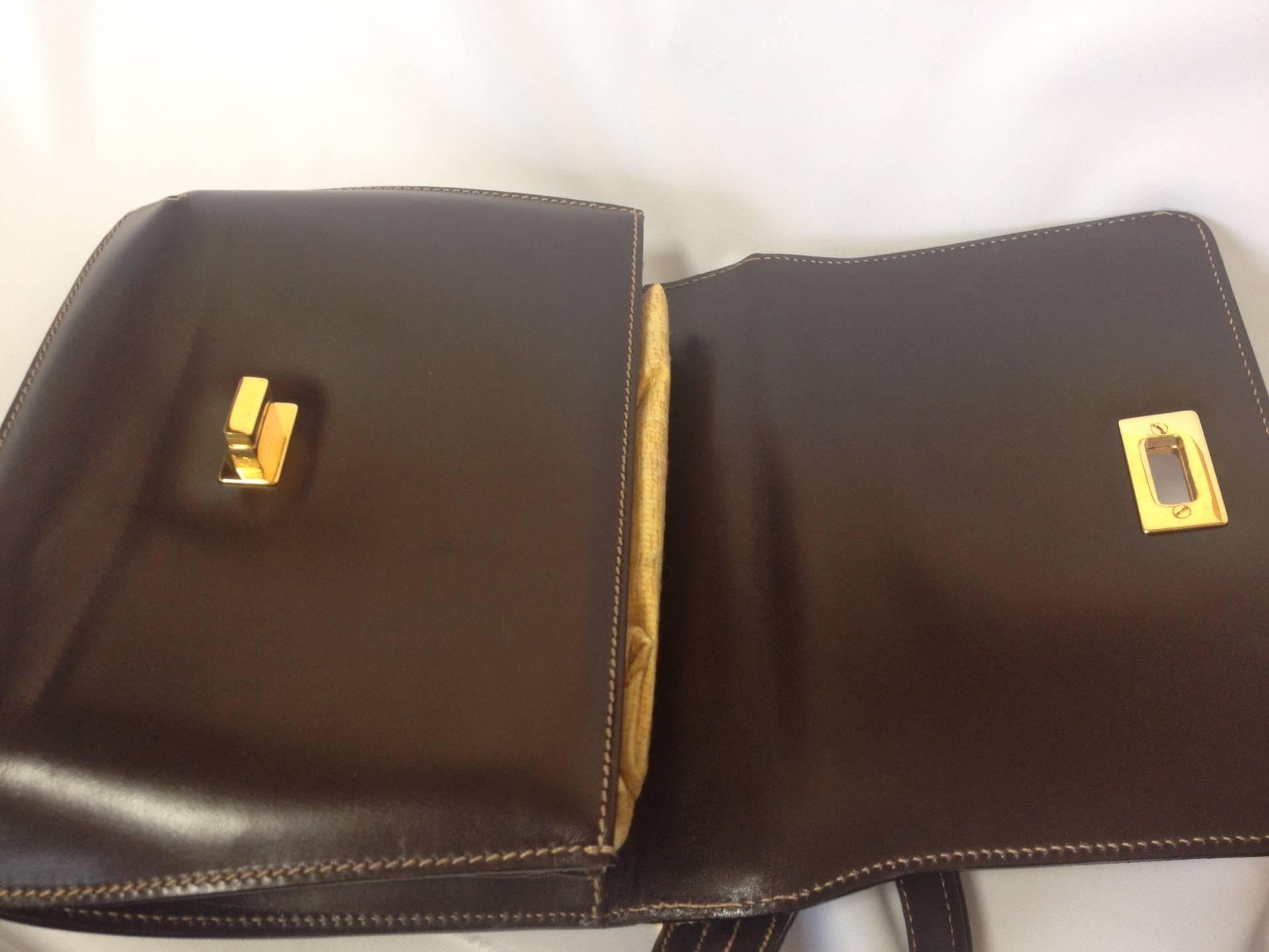 Vintage FENDI genuine dark brown leather handbag with golden FF logo at closure. For Sale 1