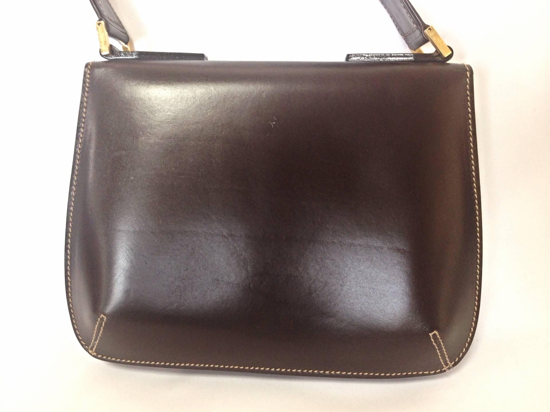Black Vintage FENDI genuine dark brown leather handbag with golden FF logo at closure. For Sale