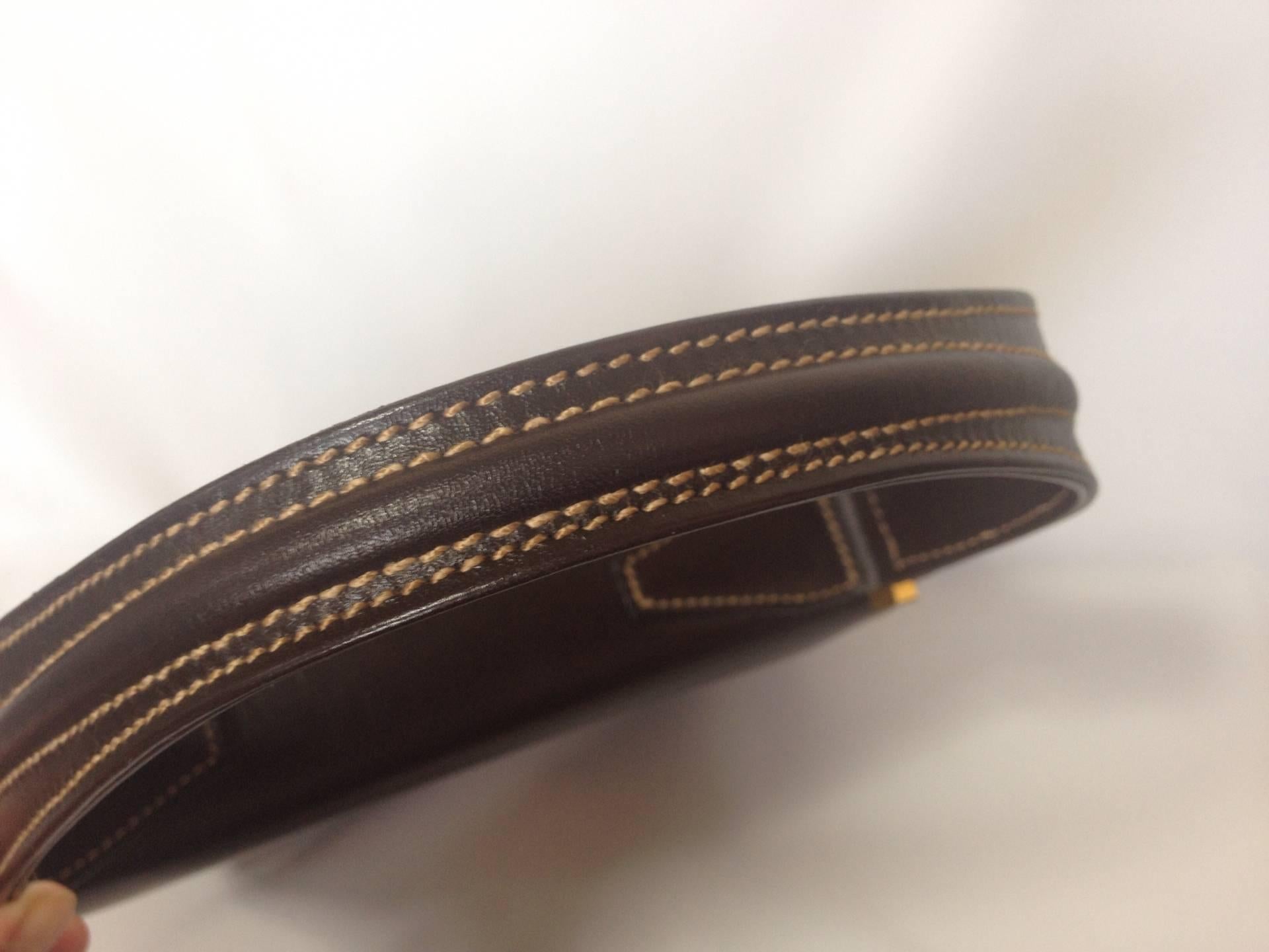 Women's Vintage FENDI genuine dark brown leather handbag with golden FF logo at closure. For Sale