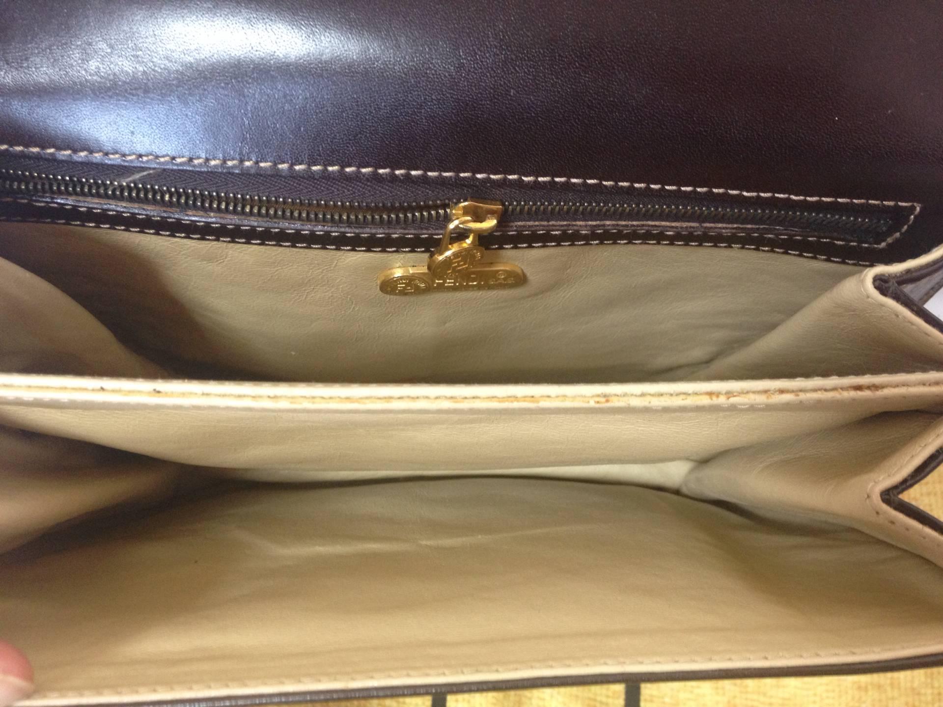 Vintage FENDI genuine dark brown leather handbag with golden FF logo at closure. For Sale 2