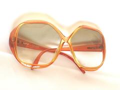 Vintage COBRA large, round oversized orange frame sunglasses with grey shades.