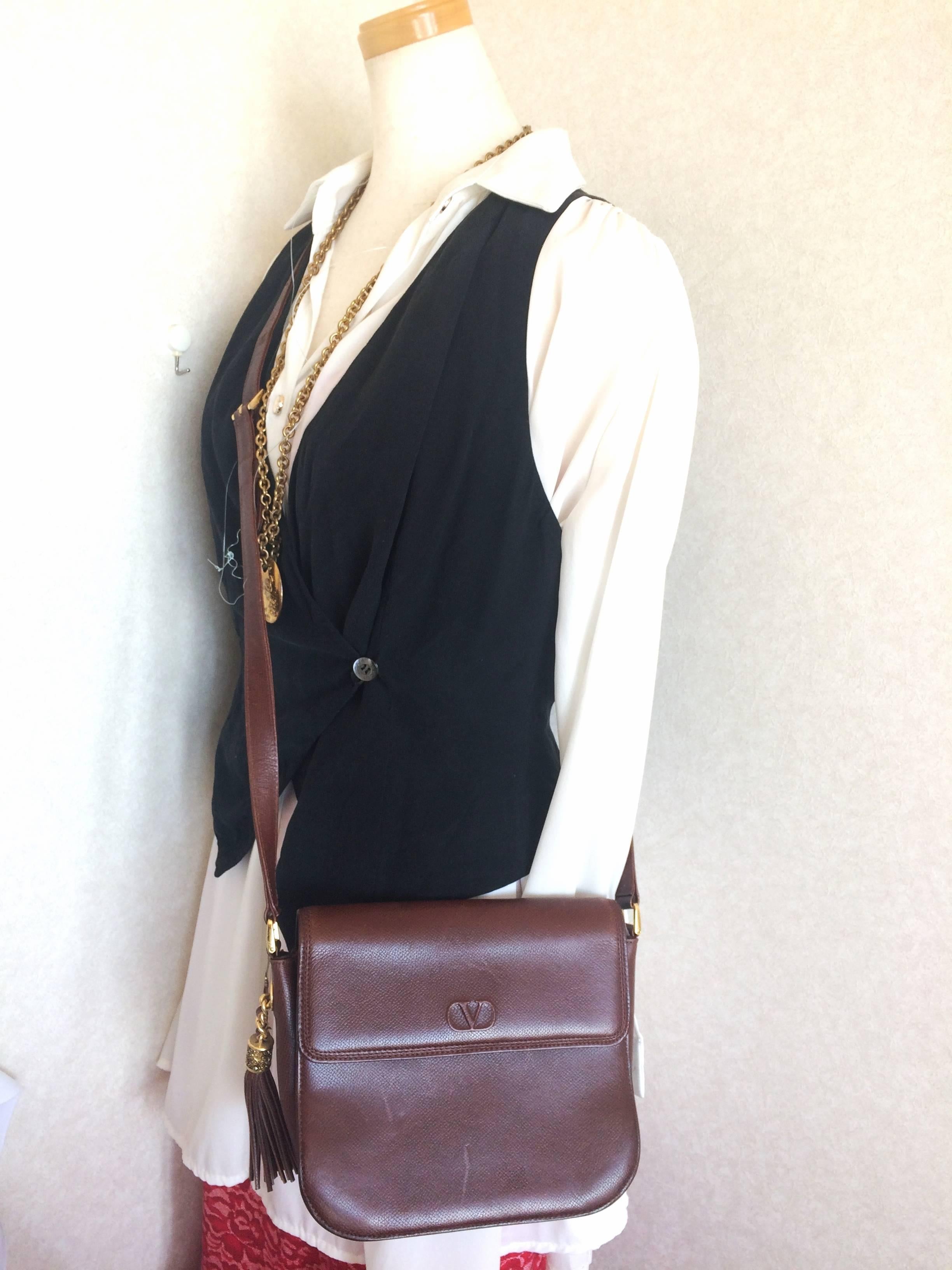Vintage Valentino Garavani dark brown leather shoulder bag with tassel charm. 3
