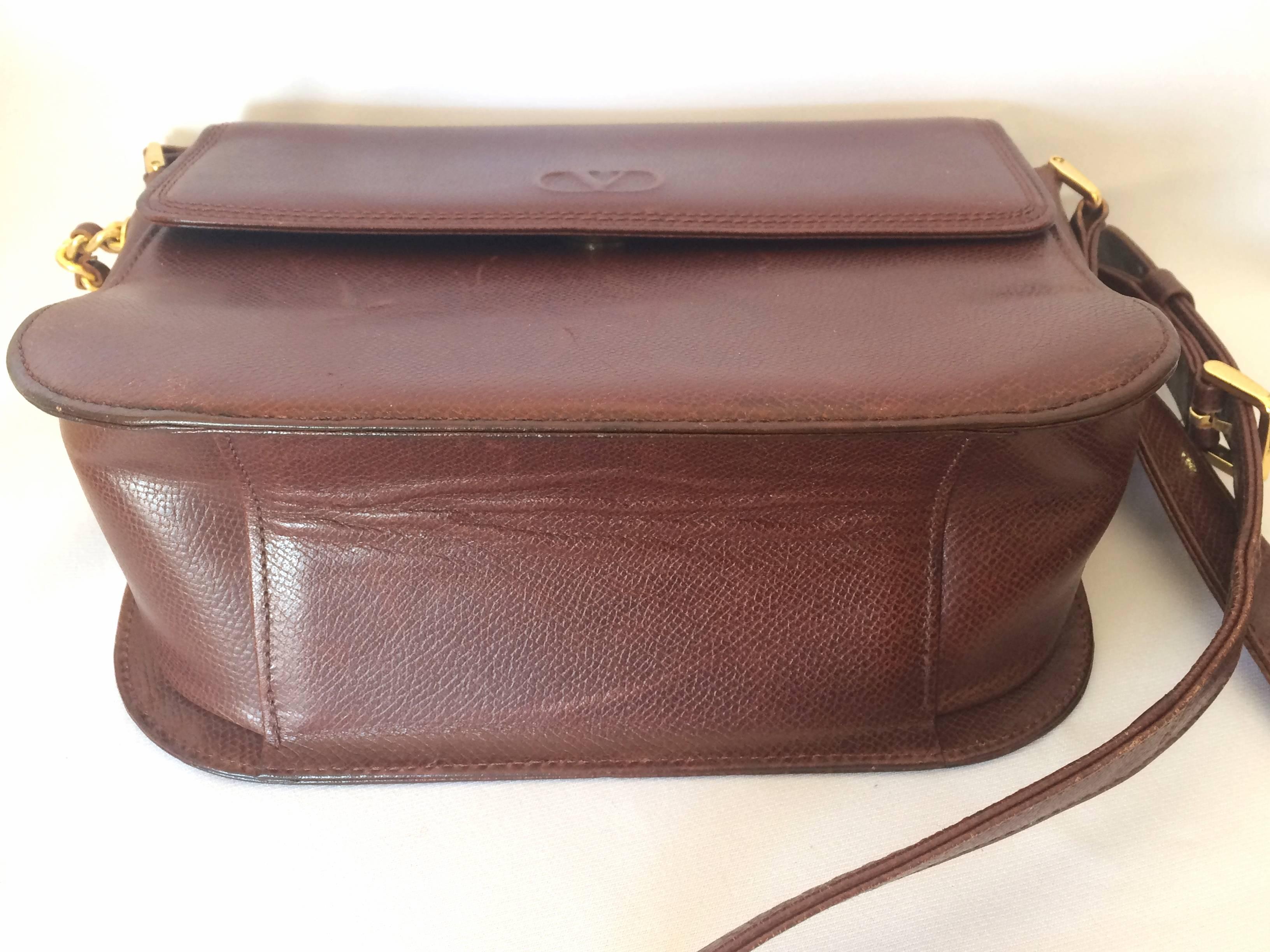 Women's Vintage Valentino Garavani dark brown leather shoulder bag with tassel charm.