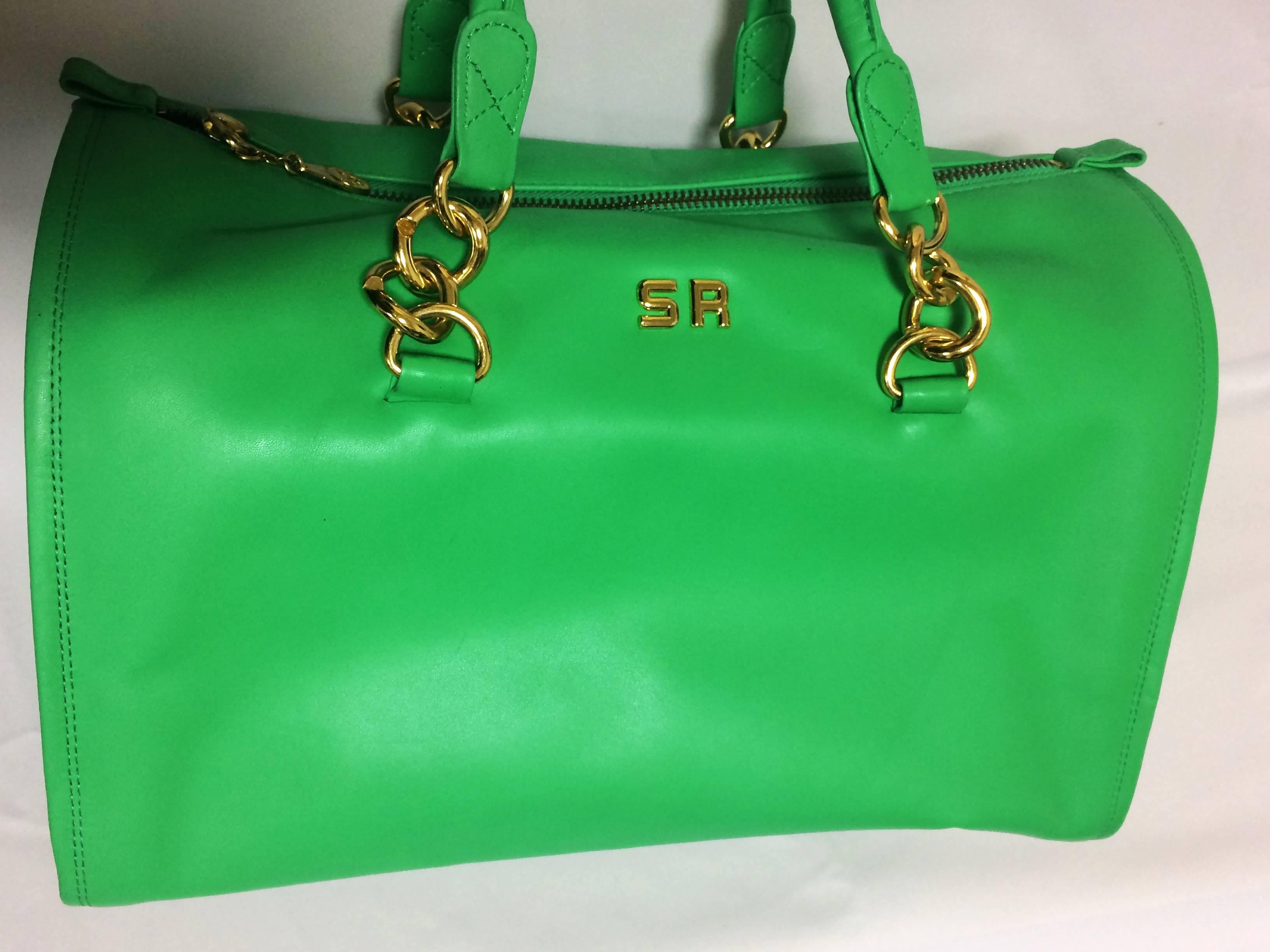 1990s. Vintage SONIA RYKIEL green leather handbag purse in speedy bag style with gold tone logo. Great daily use bag.

Th is one of the most chic and stylish SONIA RYKIEL SACS back in the era!
The bright green color will be the best accent to