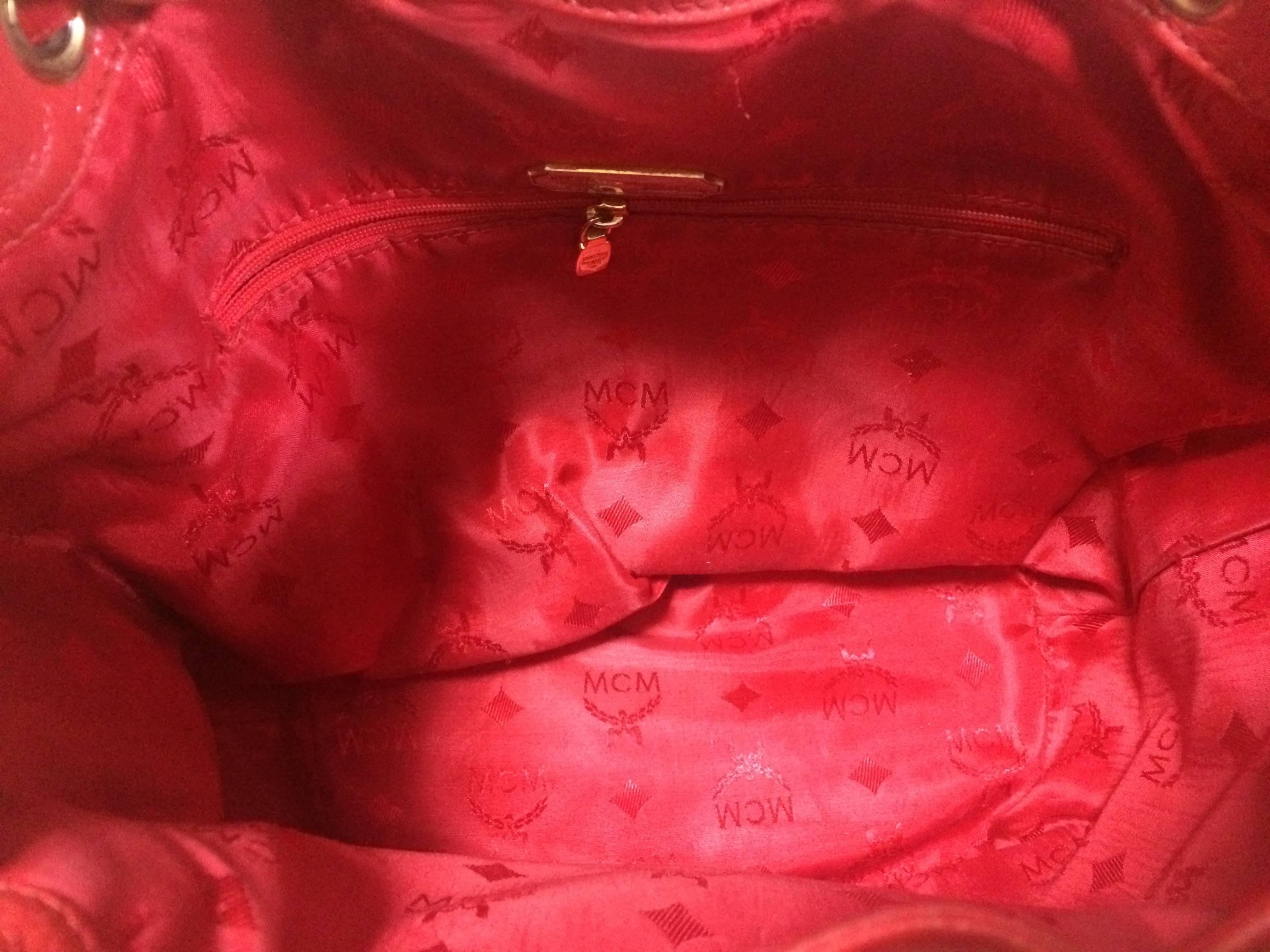 Vintage MCM genuine leather red hobo bucket shoulder bag with gold tone motifs. For Sale 2