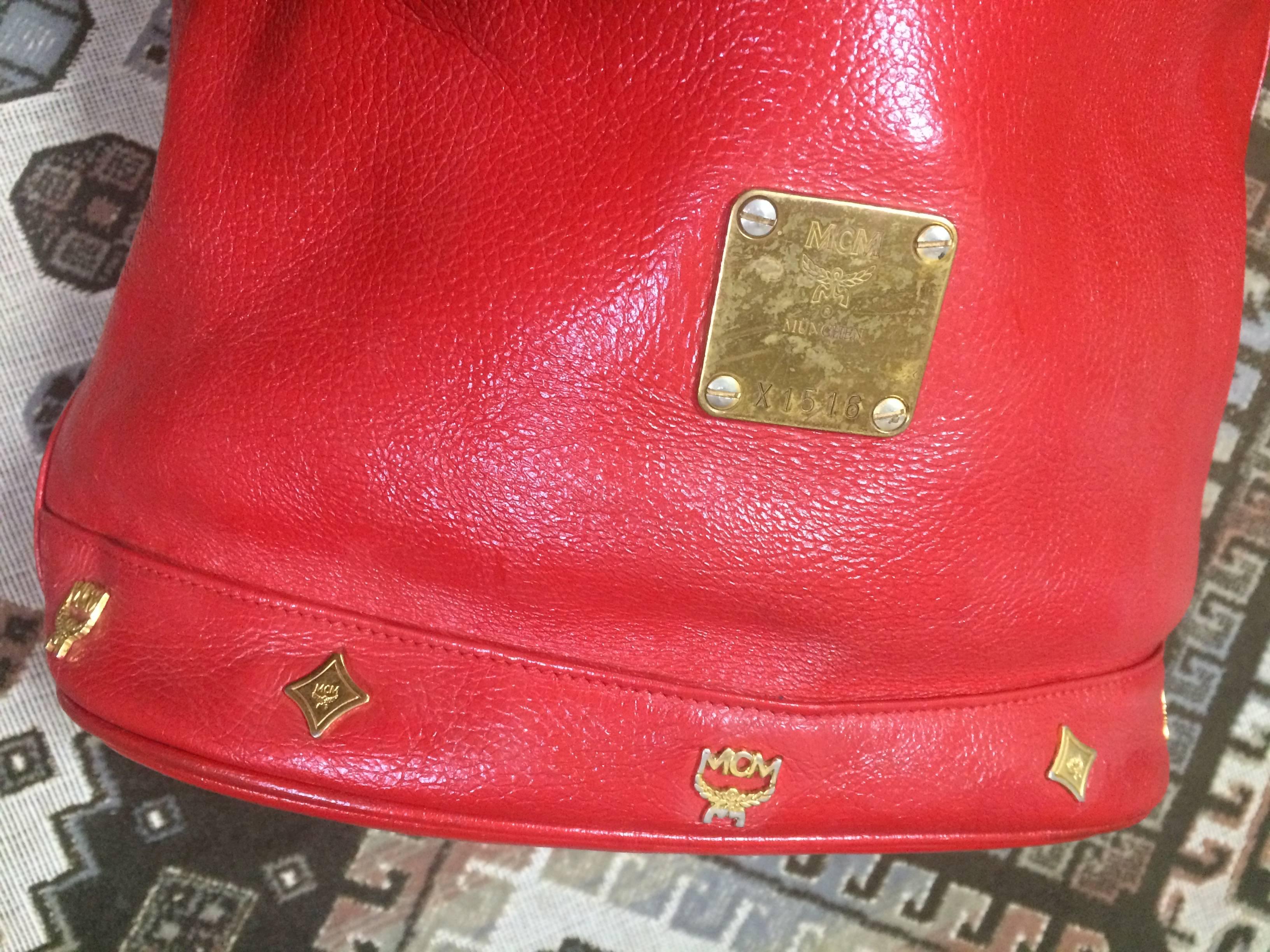 red mcm purse