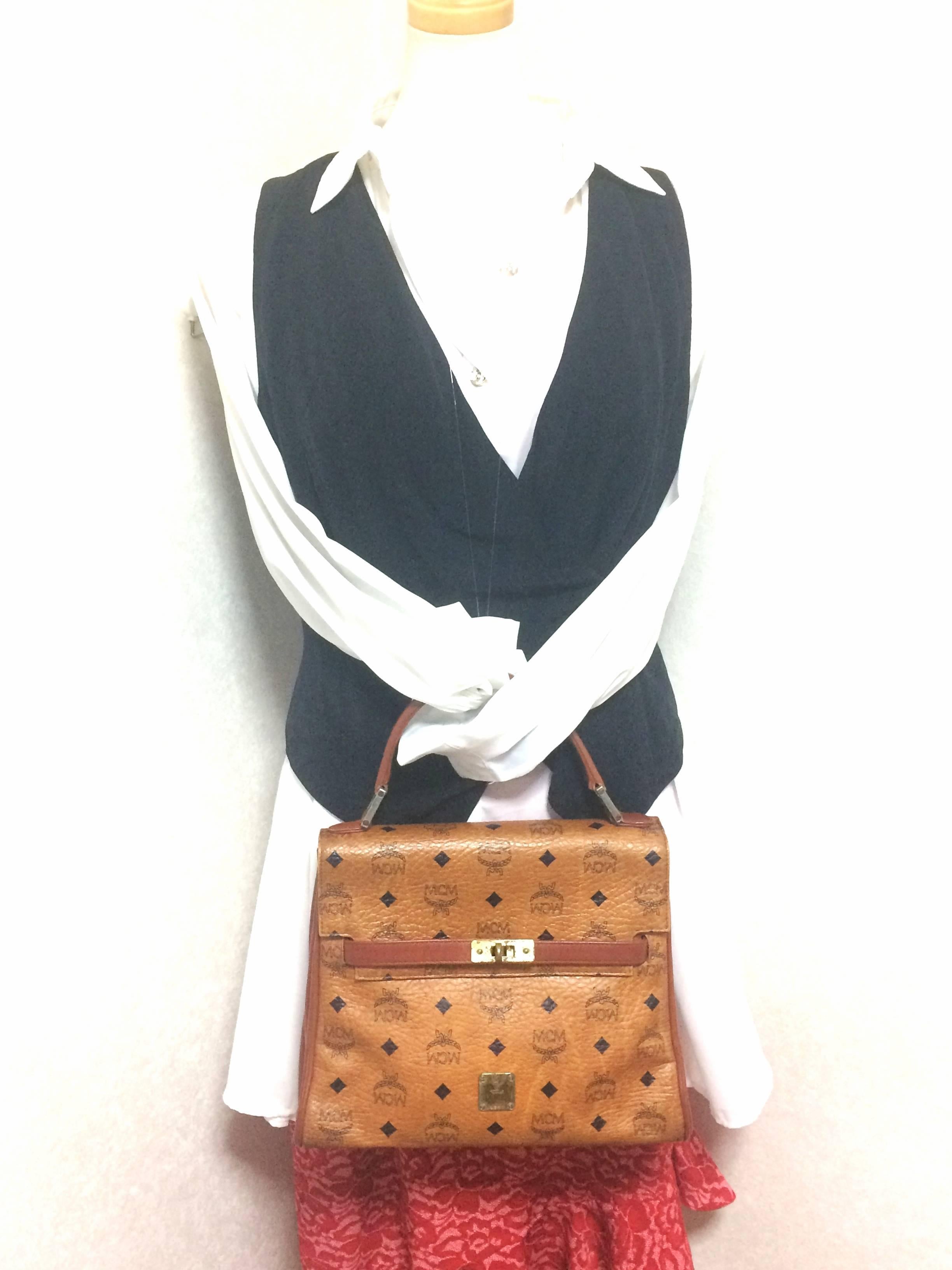 Vintage MCM Kelly style bag with golden logo plate in classic brown monogram. 3