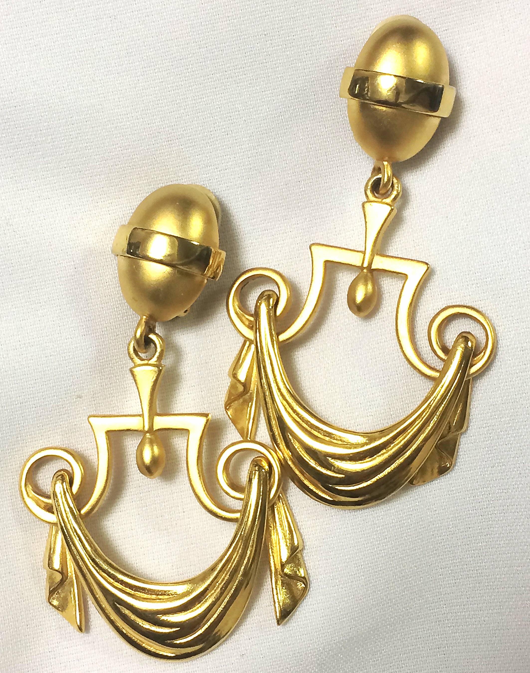 1990s. Vintage Karl Lagerfeld golden dangling earrings in drapery window curtain design. Unique and rare jewelry.

1990s. Vintage Karl Lagerfeld golden dangling earrings in drapery window curtain design. Unique and rare jewelry.
Introducing