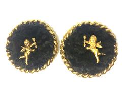 Vintage Karl Lagerfeld large round earrings with dark brown sheep fur and angel.
