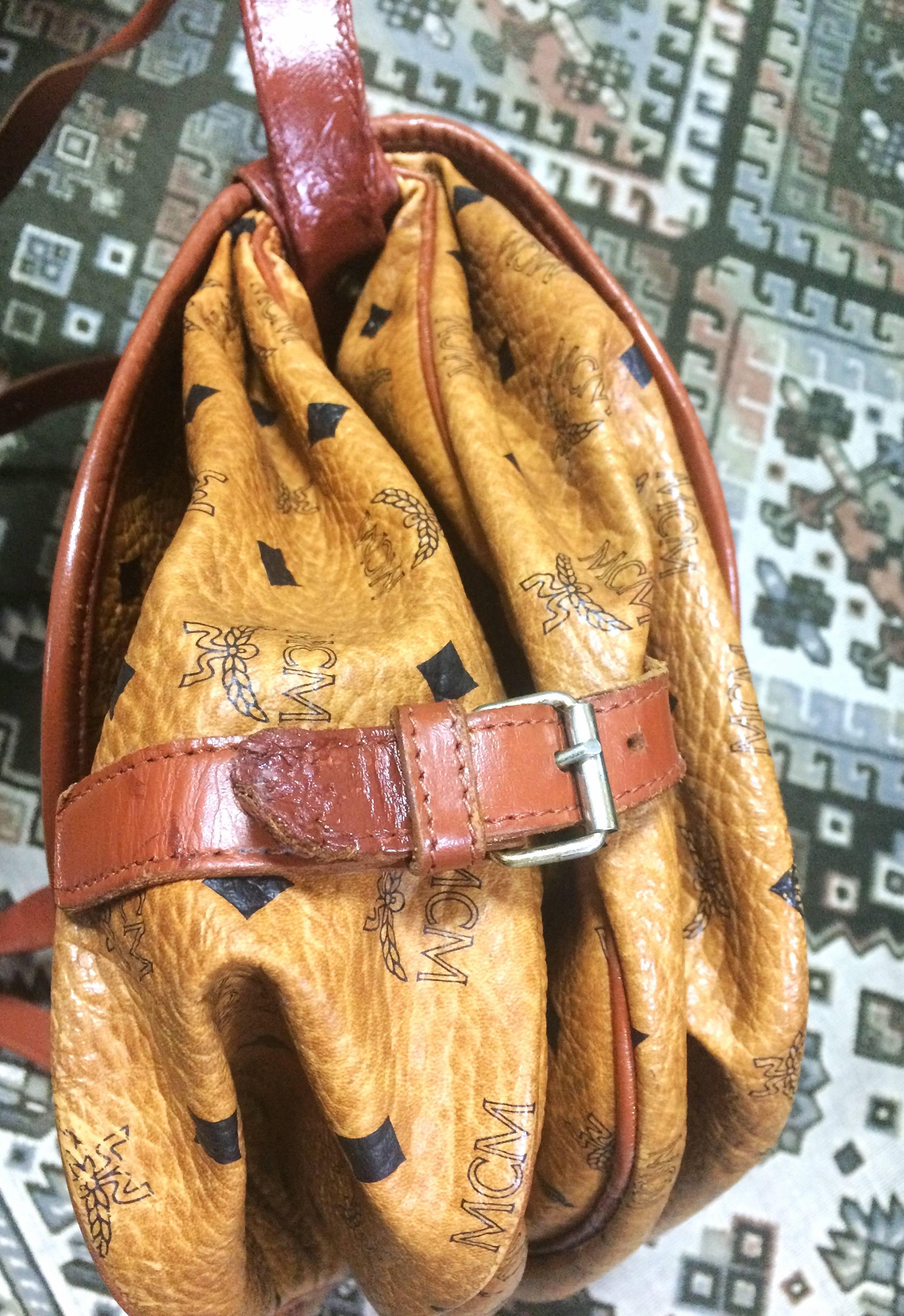 Women's or Men's Vintage MCM brown monogram saumur messenger shoulder bag with leather trimmings.