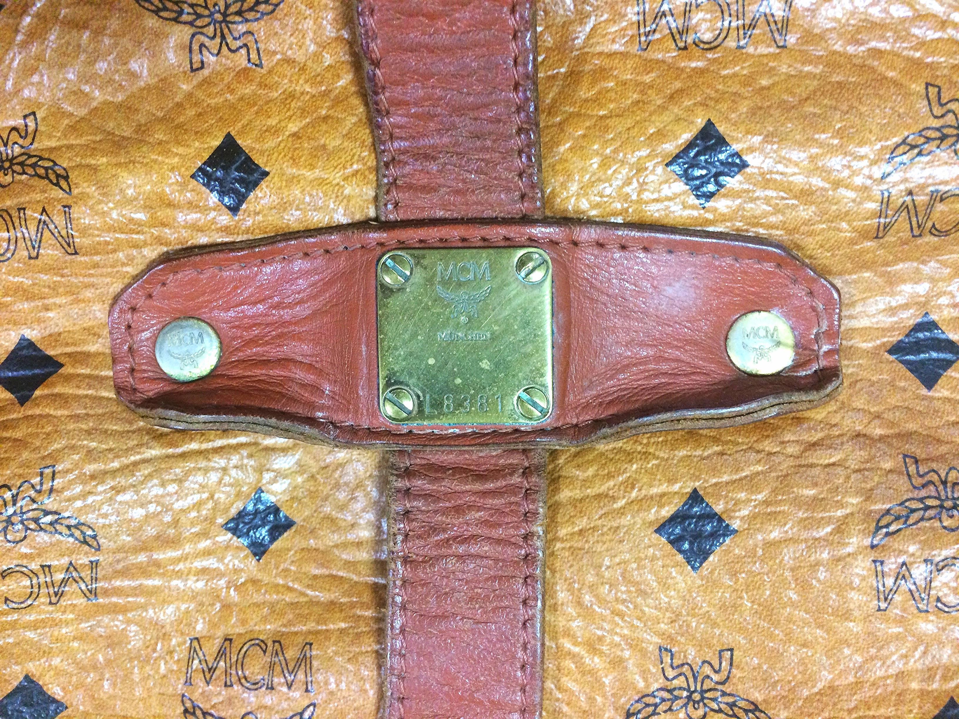 Beige Vintage MCM brown monogram saumur messenger shoulder bag with leather trimmings.