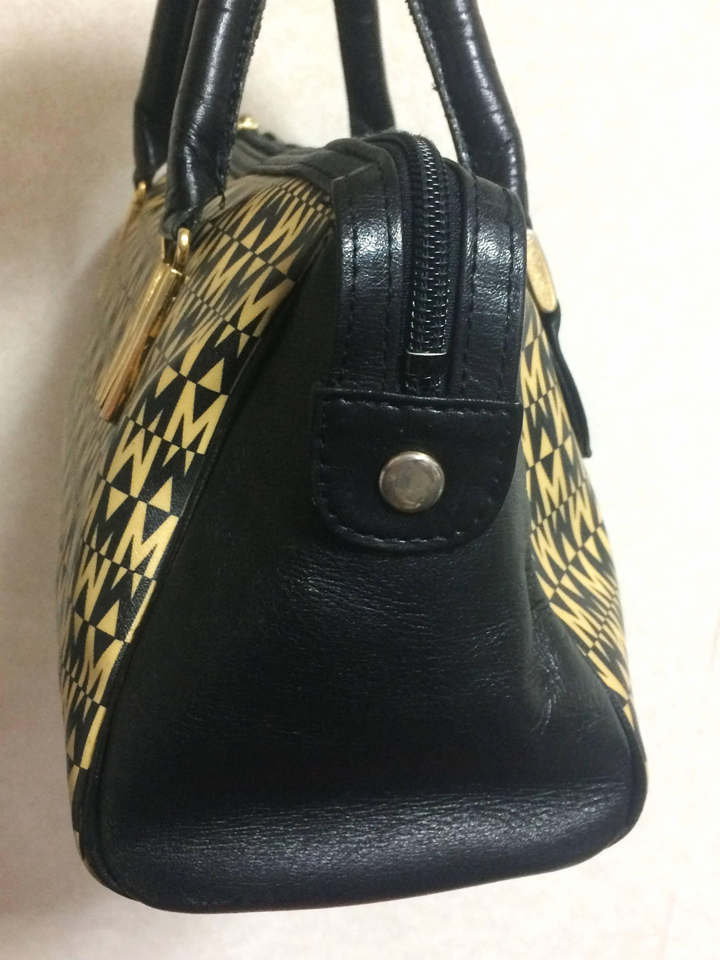 Black Vintage MOSCHINO black and ivory beige logo M print handbag, mini duffle bag. For Sale