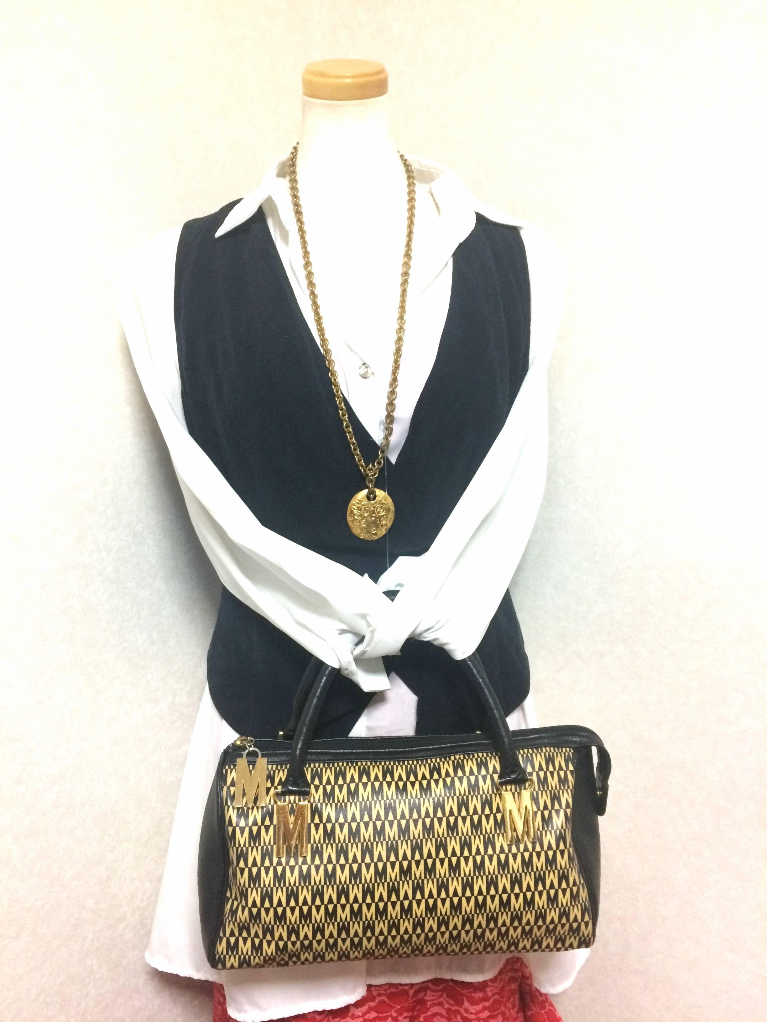 Vintage MOSCHINO black and ivory beige logo M print handbag, mini duffle bag. For Sale 2