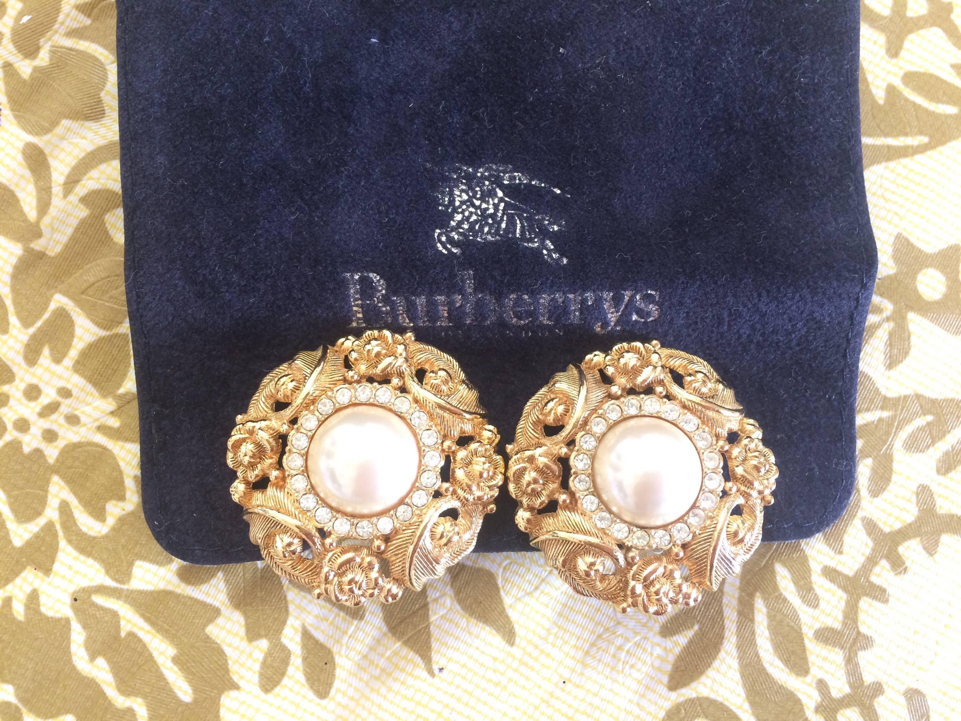 1990s. Vintage Burberrys golden Edwardian flower and arabesque design earrings with faux pearl, crystal stones,. Rare Burberry masterpiece.

Elegant and gorgeous vintage jewelry is here for you from Burberry, back in the old era! 
Great gift idea.