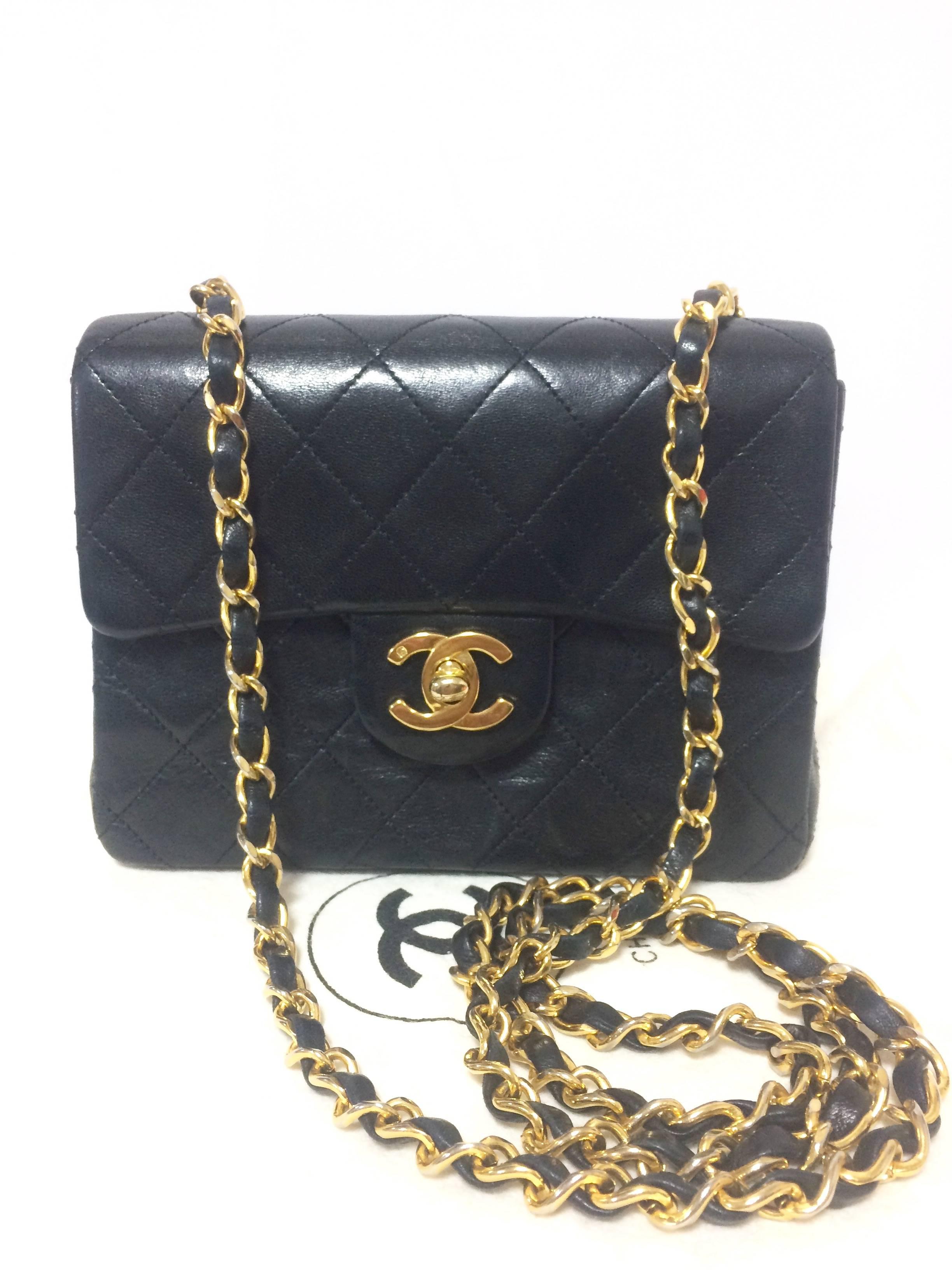 1990s. Vintage CHANEL black lamb leather flap chain shoulder bag, classic 2.55 mini purse with gold tone CC closure.

Introducing one of the most popular pieces from CHANEL back in the early 90's, vintage Chanel classic black lambskin 2.55 mini