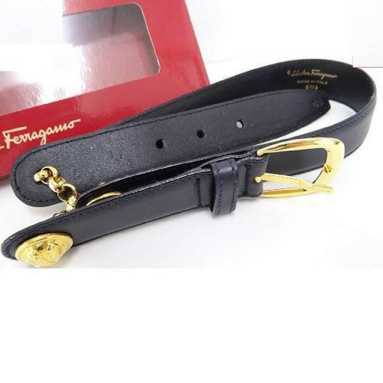 1990s. MINT. Vintage Salvatore Ferragamo black leather and chain belt with golden round charms. Hot vintage Ferragamo masterpiece. Sexy. Size 65.

Here is another fabulous and sexy piece from Salvatore Ferragamo back in the era.
Navy leather belt