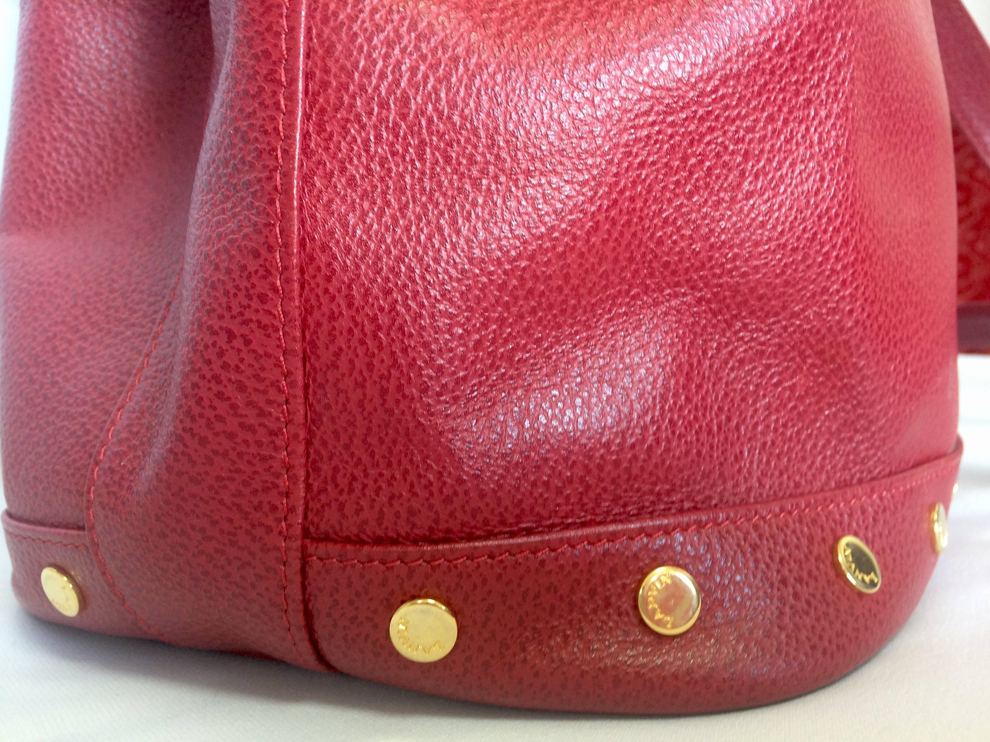 Women's Vintage LANVIN apricot red hobo bucket shoulder bag with studded logo motifs.