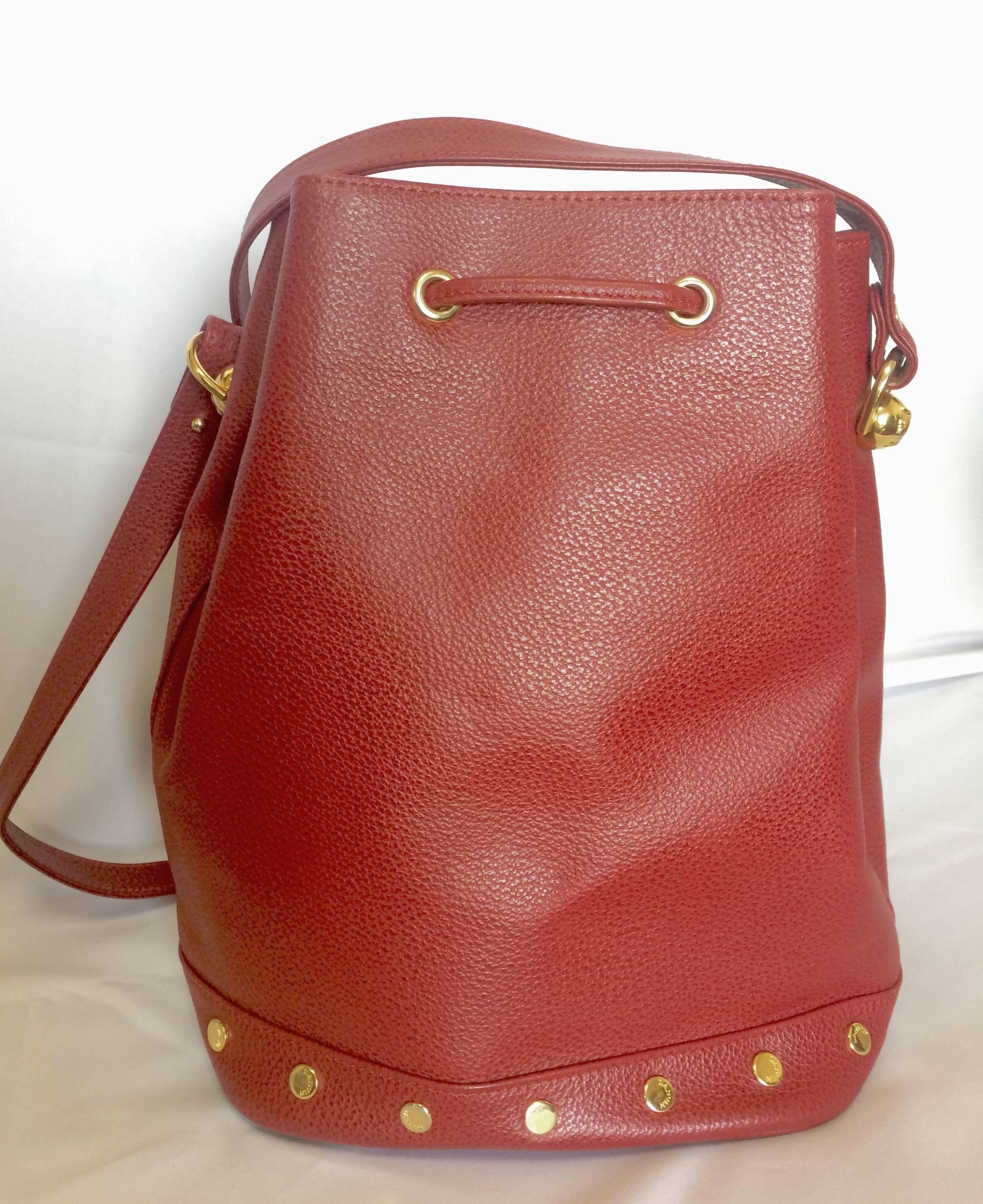 Red Vintage LANVIN apricot red hobo bucket shoulder bag with studded logo motifs.